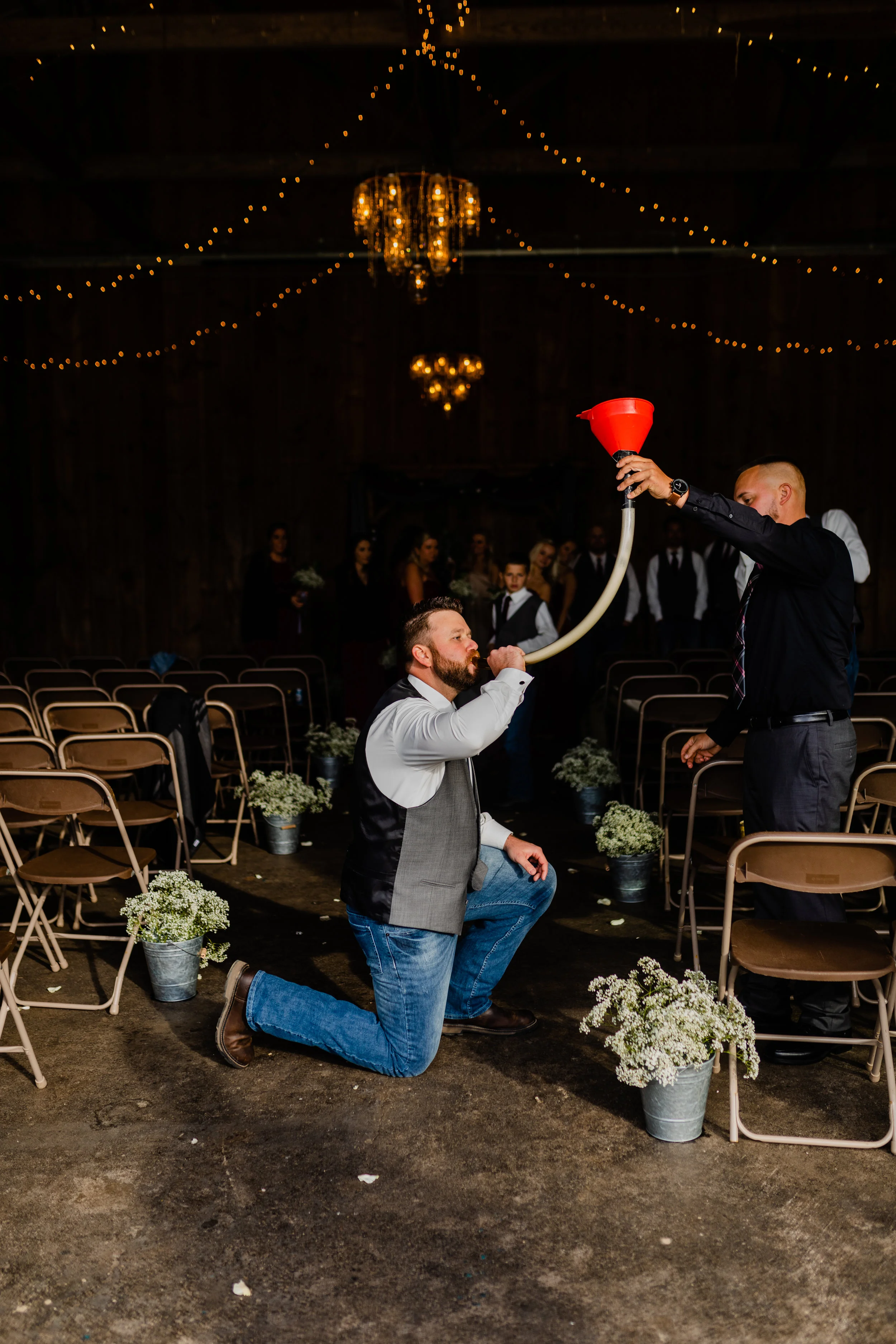 groom-doing-a-beer-bong-after-ceremony.jpg