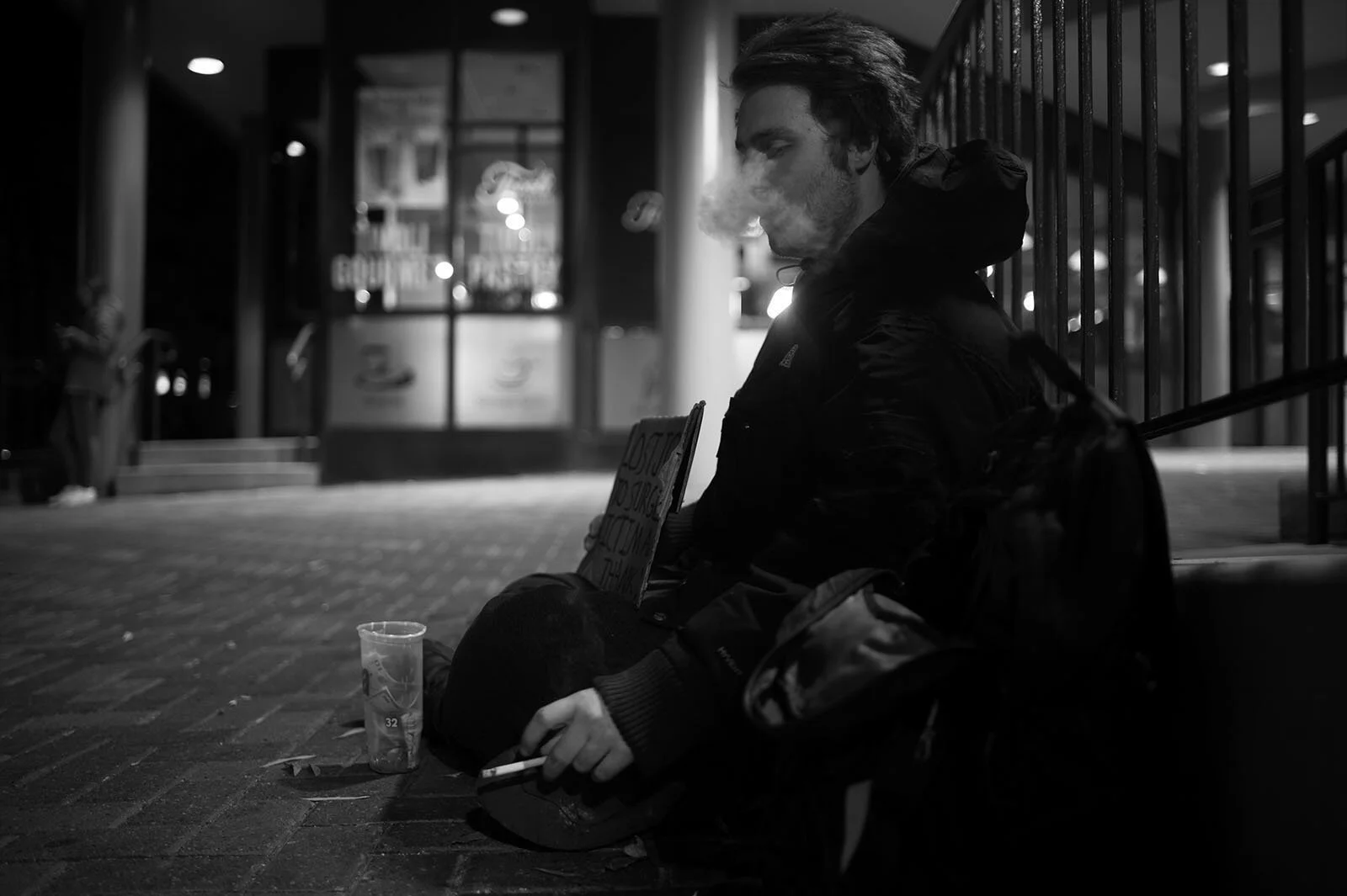 Kenyon smokes a cigarette at Ballston Metro Station before heading to catch the next metro home Nov. 23.