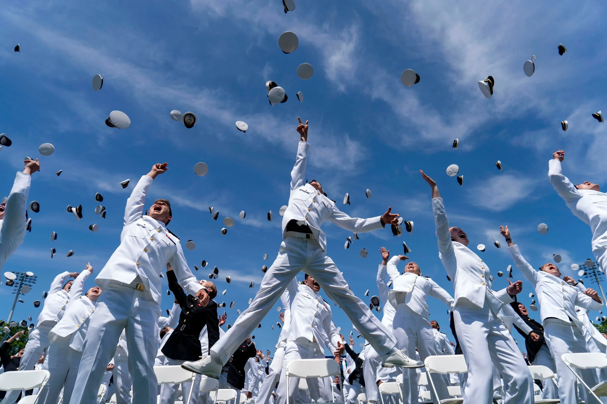  Graduating Midshipmen toss their caps to conclude the U.S. Naval Graduation and Commissioning Ceremony in Annapolis, Maryland on Friday, May 26, 2023. 