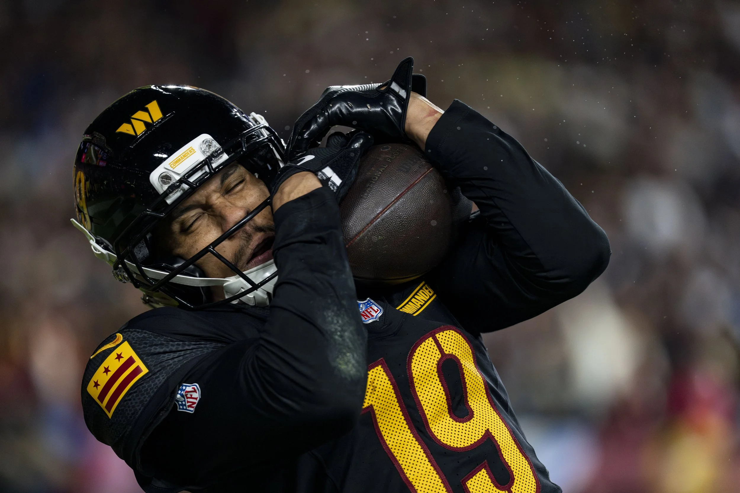  Washington Commanders wide receiver Chris Moore (19) catches a touchdown pass during the second quarter of a game against the Chicago Bears at Northwest Stadium in Landover, Maryland on Monday, October 13, 2025. 
