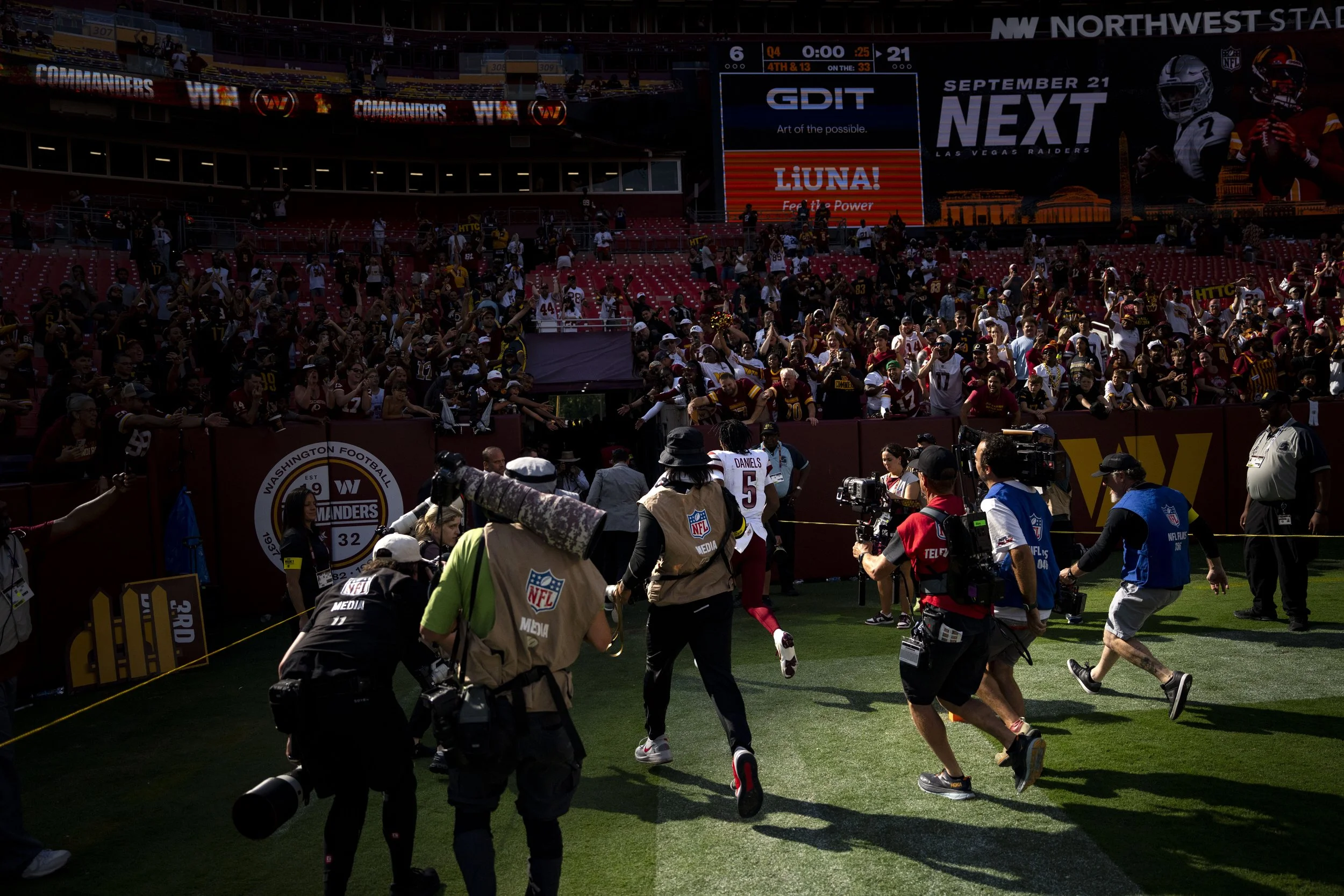  Washington Commanders quarterback Jayden Daniels (5) leaves the field after winning a game against the New York Giants at Northwest Stadium in Landover, Maryland on Sunday, September 7, 2025. 