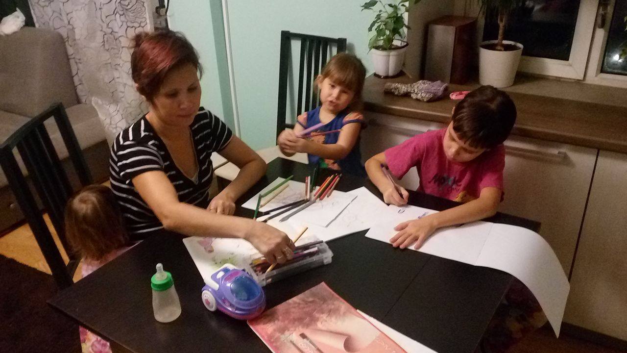 Saule works with Vera. Two of her young sisters are next in turn for homeschooling.