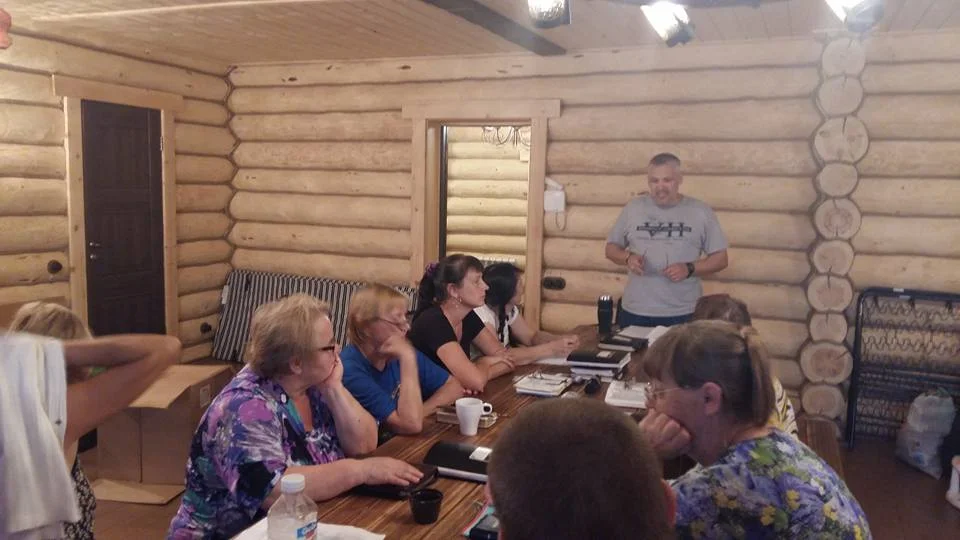 Oleg Volkov teaching adults on how to help others change.