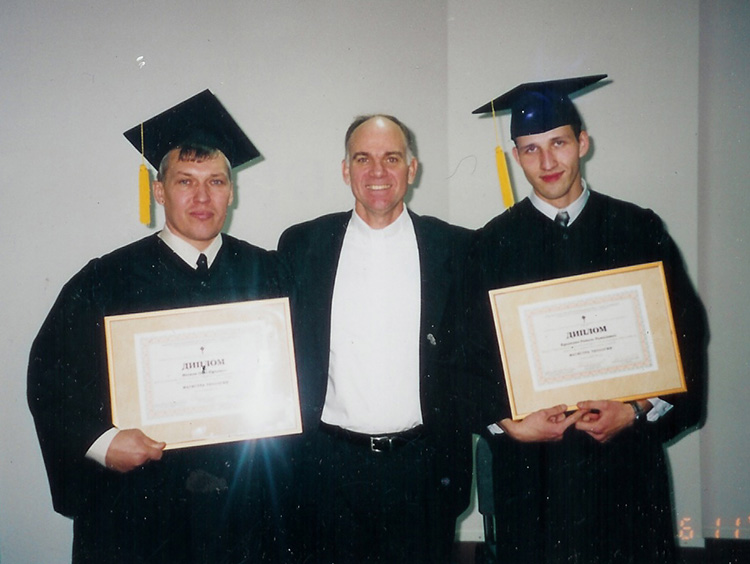 Seminary Rector Rev. Blake Purcell with Oleg (left) and Ravil (right) at their graduation ceremony.