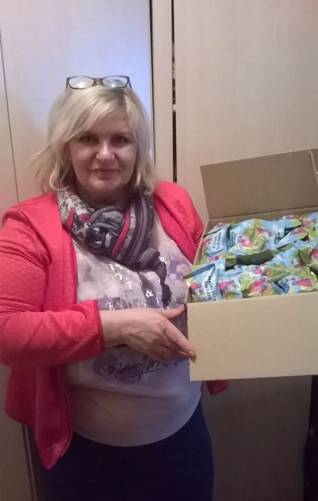 Timur's Wife Olga with Treats for Students