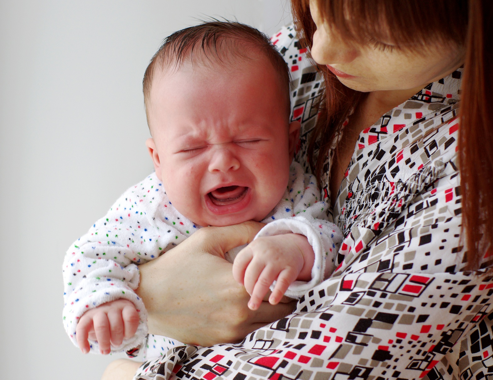 baby fussing at nipple