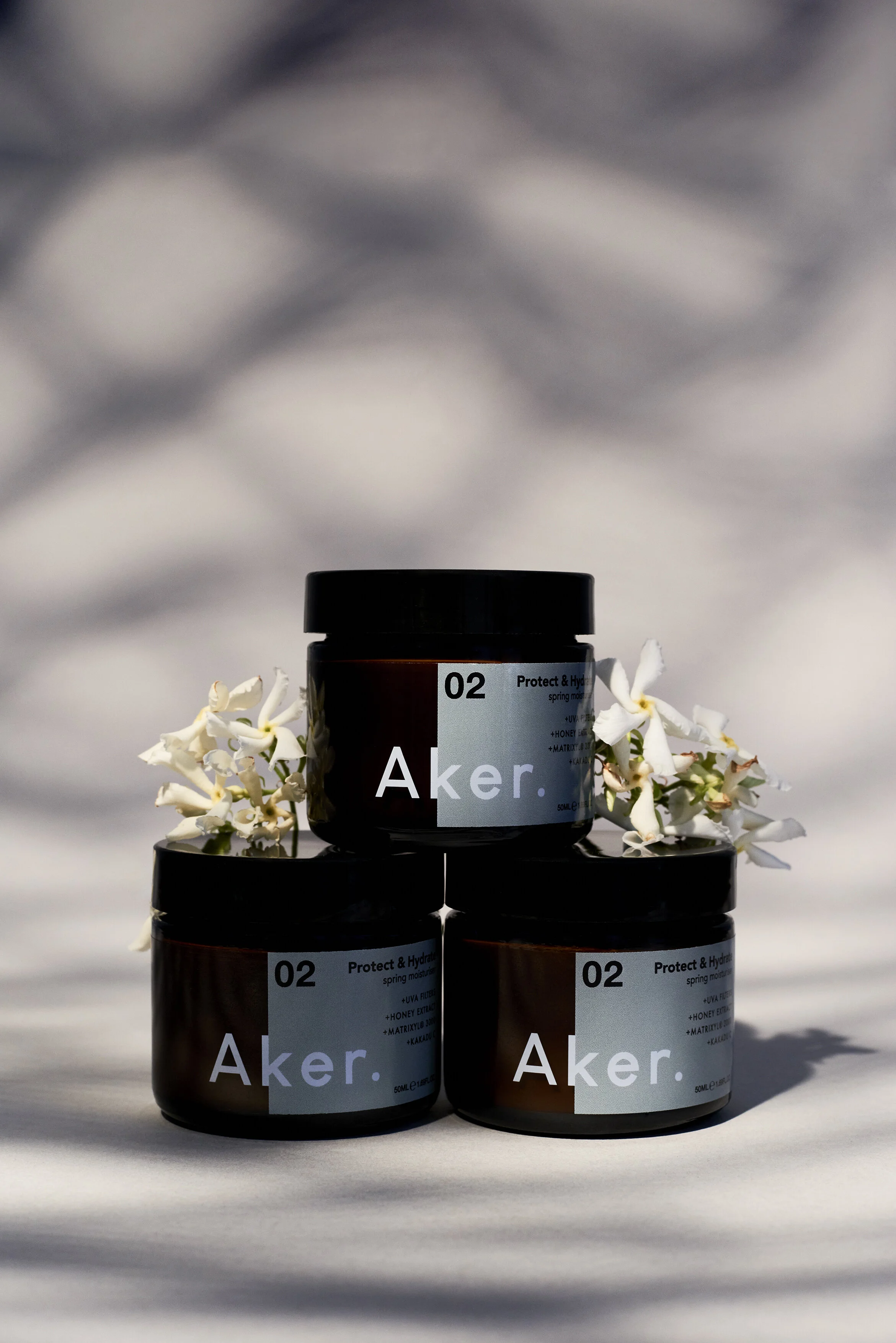 Aker Spring Pot Stack With Flowers Portrait.jpg