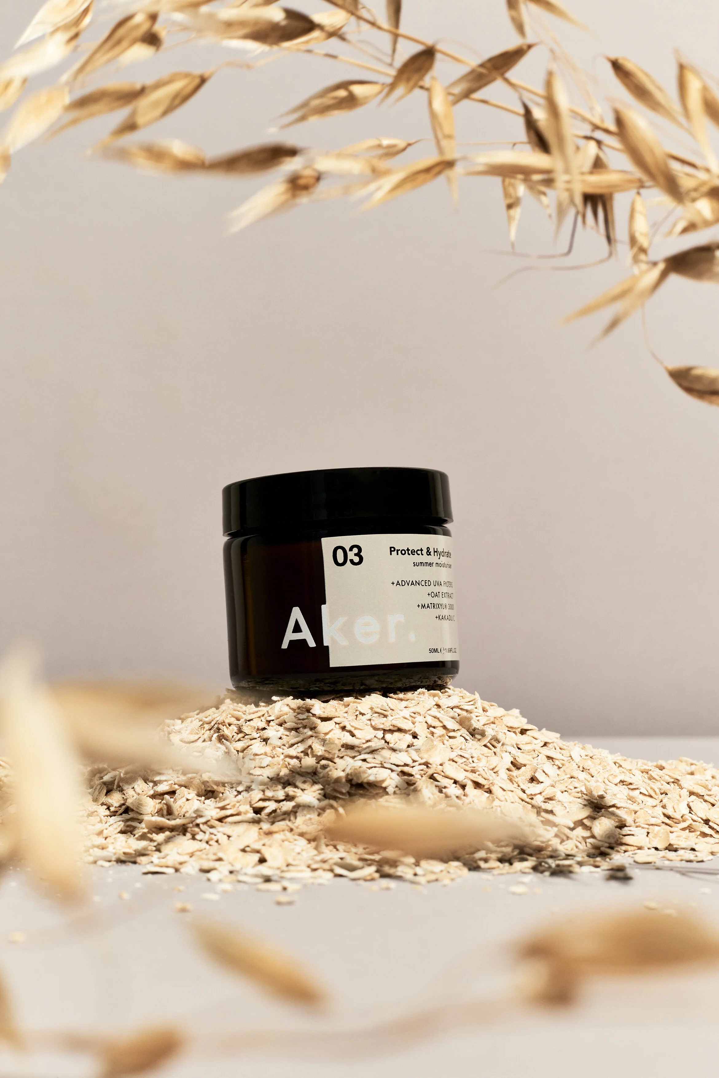 Aker Summer_Oat Pile With Oat Plant.jpg