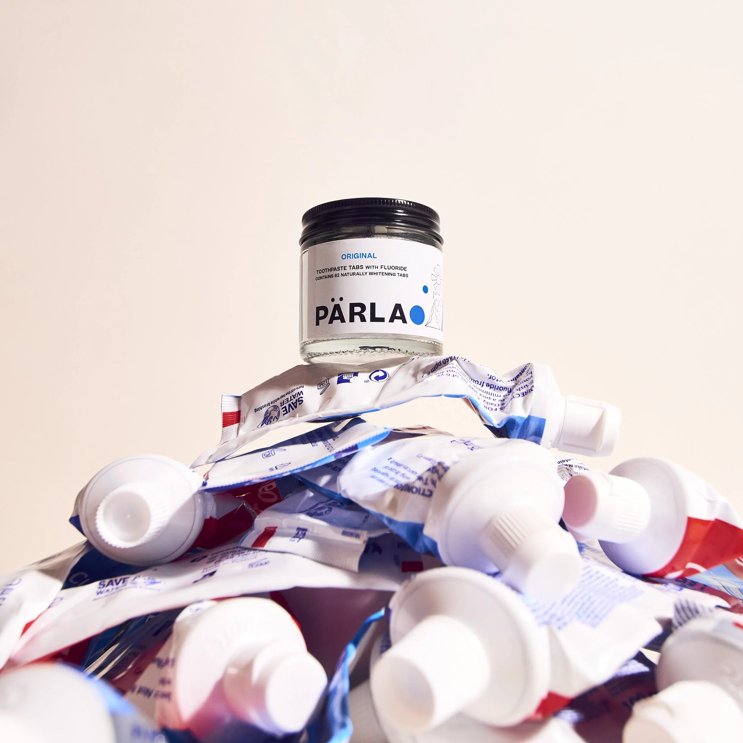 Parla_Jar_On_Pile_Of_Tubes_Original_Blue.jpg