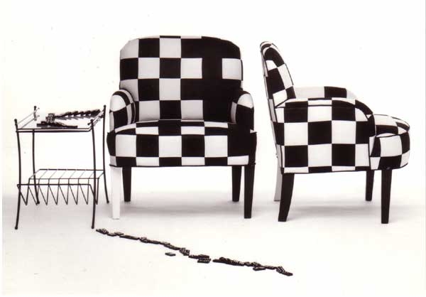 Domino checks fall off this appliquéd chair with a single white painted leg. 