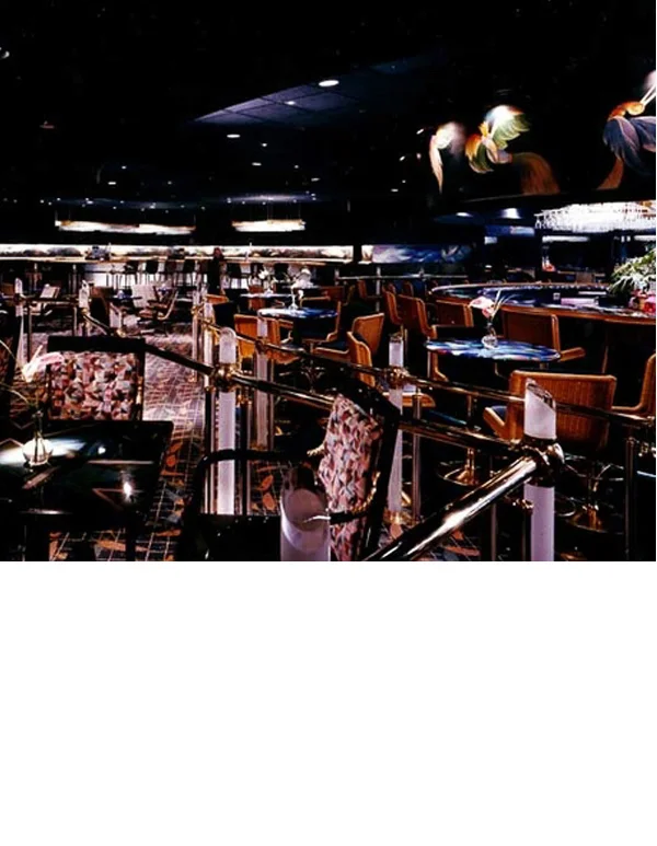 A revolving bar was built on the platform initially constructed for a bucking bronco in a previous club. Birds were painted on soffit over the bar by Carlos Alfonzo.