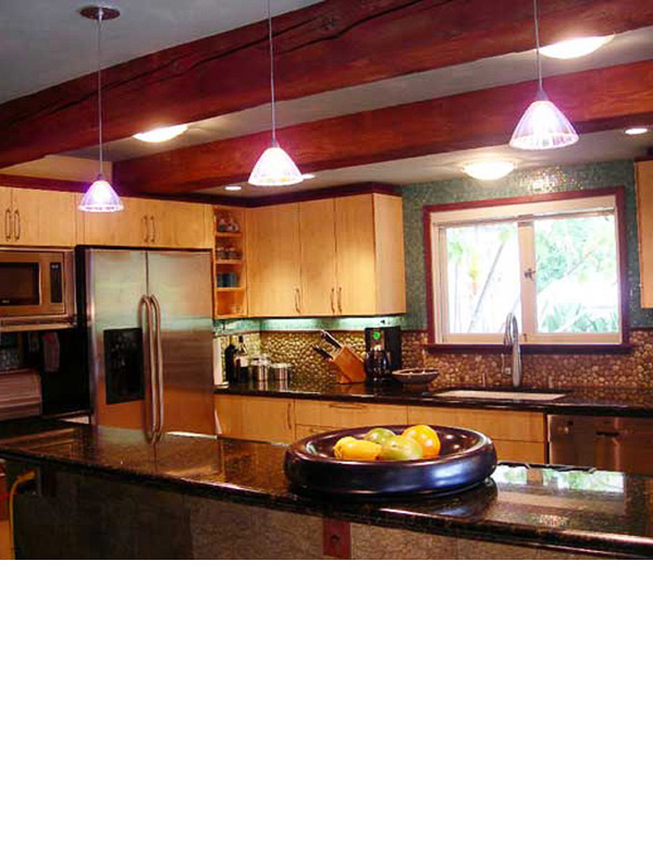  Floating ceilings were achieved by trimming the tops of cabinets in mahogany to match the color of beams. 