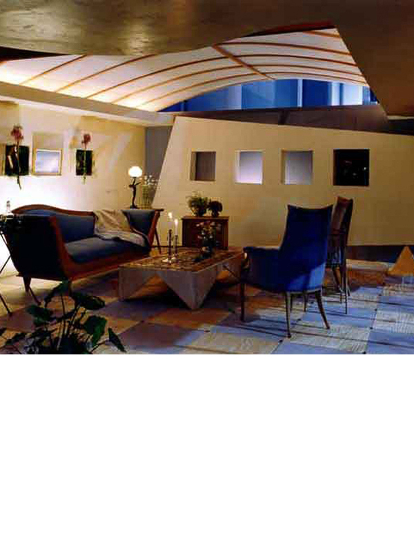  This project was commissioned by the City of Miami to encourage construction after Hurricane Andrew. The room shows a floor of tinted construction-grade plywood, an existing lath wall on the right and a TV wall balanced on a gilded pyramid. 