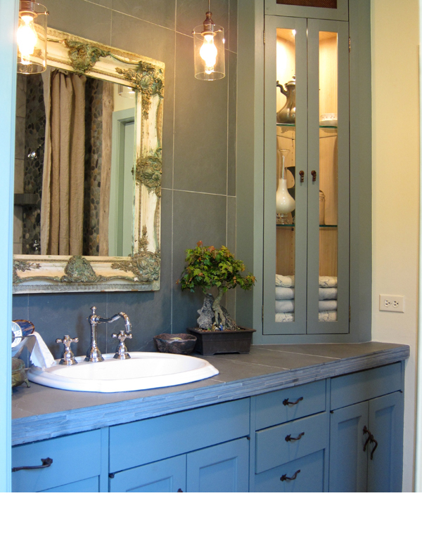 Stacking strips of slate to the face of the counter suggests the idea of multi layers of stone.