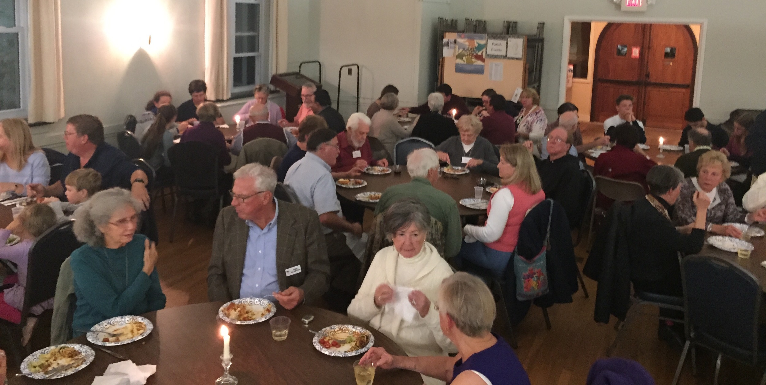 Diners at the All Saints Pot Luck