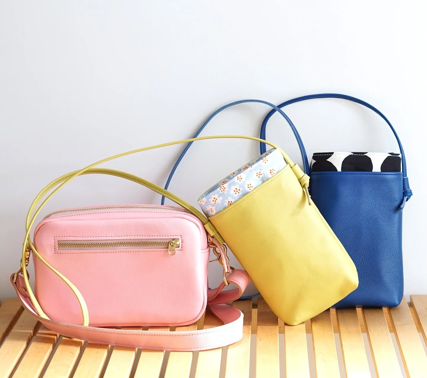 A trio of cuties ☺️ &bull; Pocket Crossbodies in cobalt and chartreuse, and a Camera Bag in bubblegum