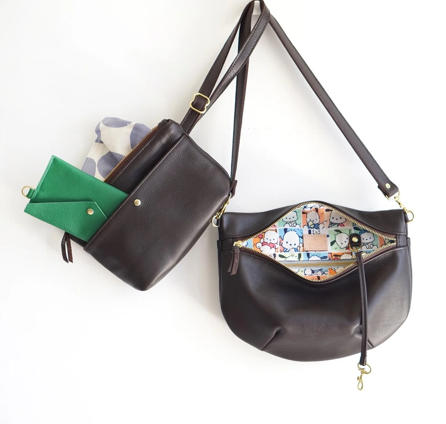 I know you all love Miffy but what about Pochacco? &bull; XL Waist Bag in espresso, Deluxe Cash Envelope in clover, Mama Dumpling in espresso (with Pochacco)