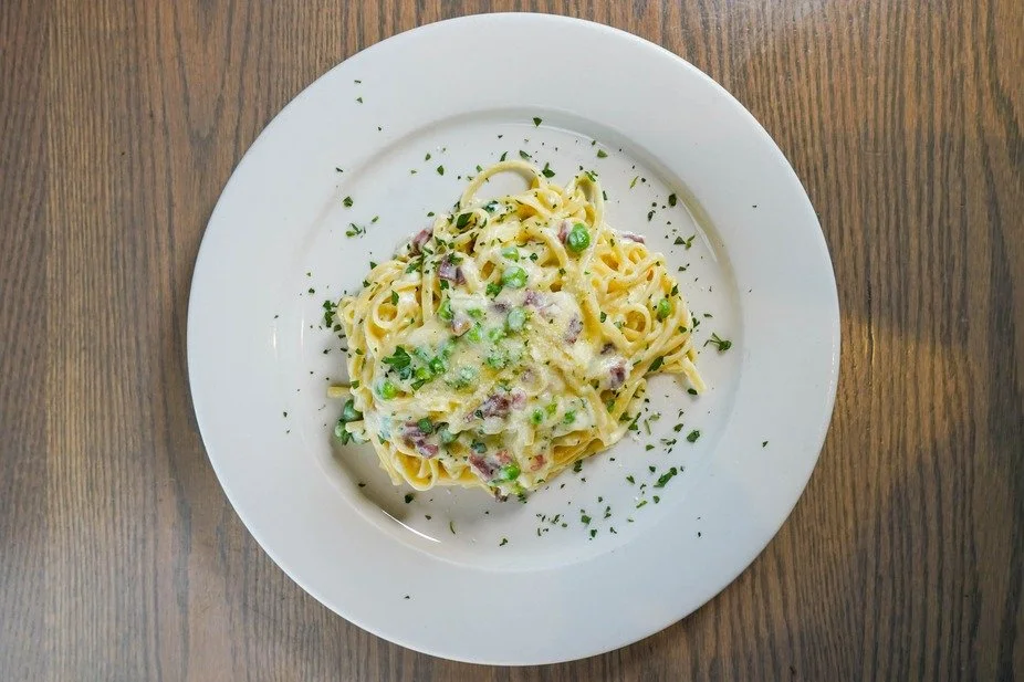 Experience the comforting flavors of our creamy pasta, perfectly garnished with fresh herbs and savory bits.

#FirstAndLastTavernPlainville #ExplorePlainville #BarAndRestaurant #CreamyPasta #ComfortFood #BarAndGrill