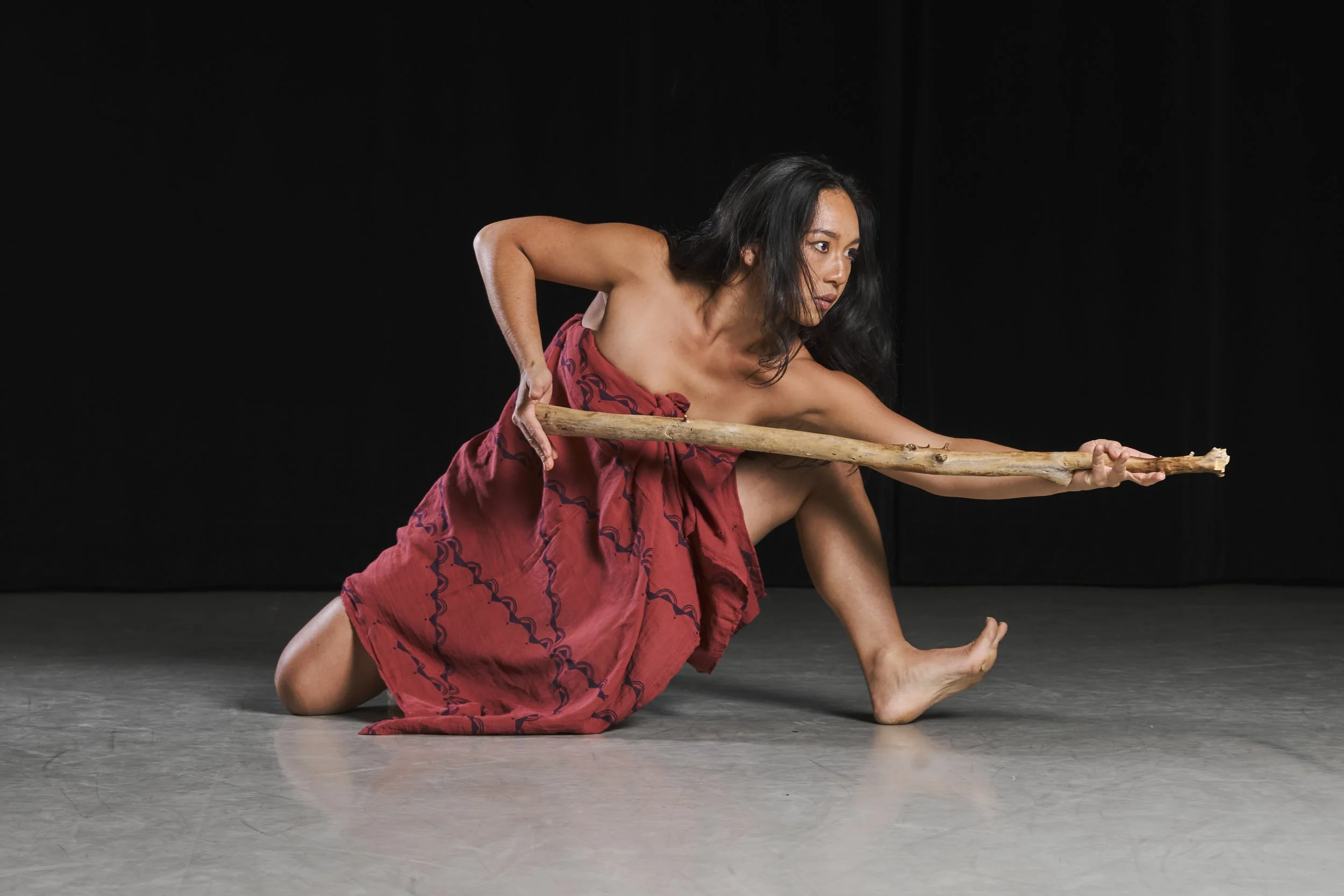 2024 McKnight Dancer Fellow Kealoha Ferreira dancing with a stick