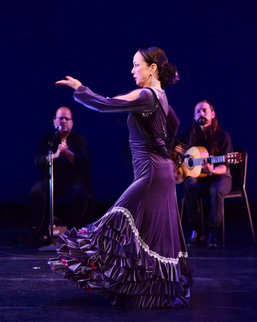 Sachiko Nishiuchi dancing with musicians behind her