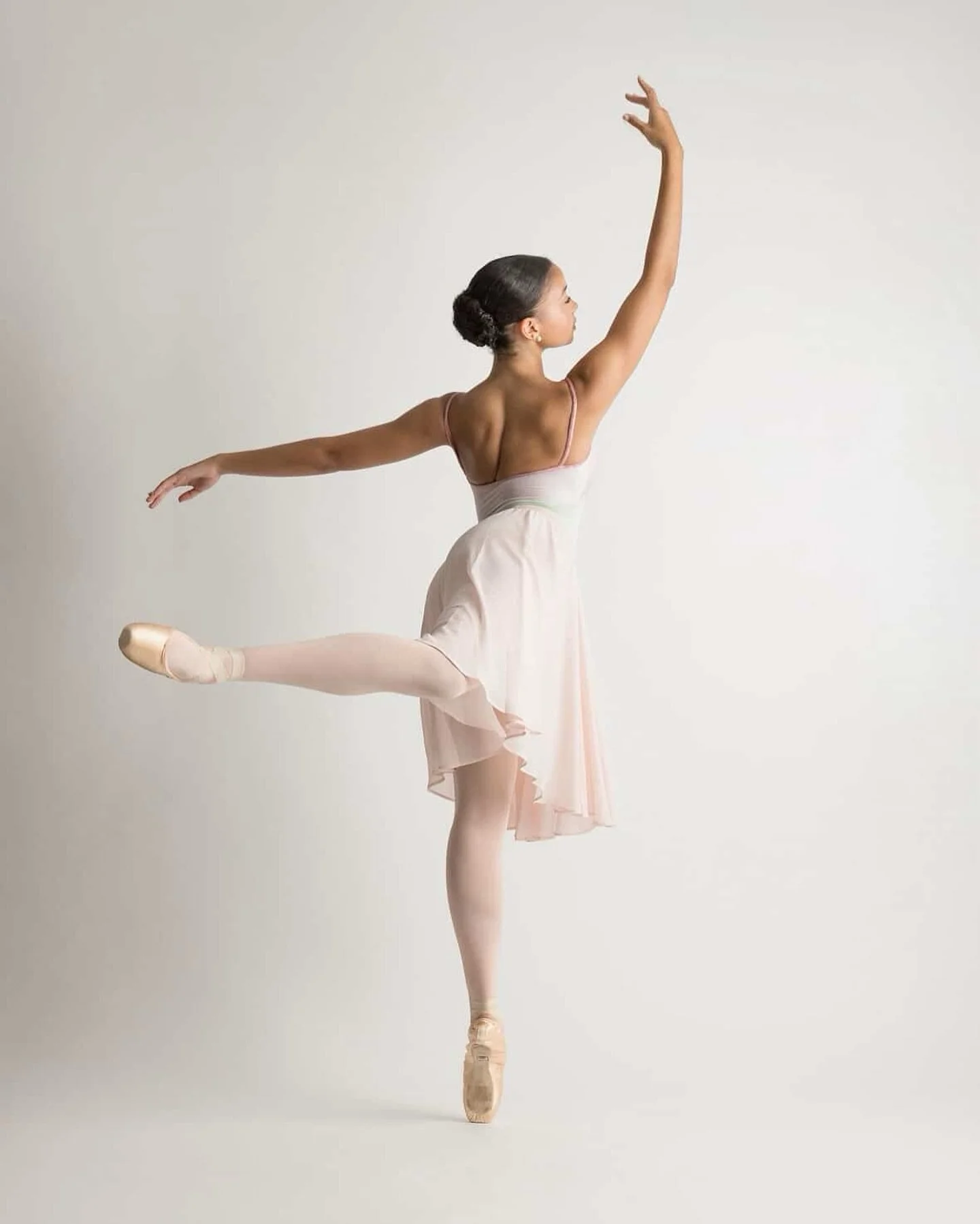 🩰

#browngirlsdoballet #brownballerina #dancephotography 

🩰: @m1ka.hannah 
📸: @decoroimages 

Image Description: Dancer poses en pointe in an attitude position facing away from the camera. One arm is above her head and the other is extended outwa