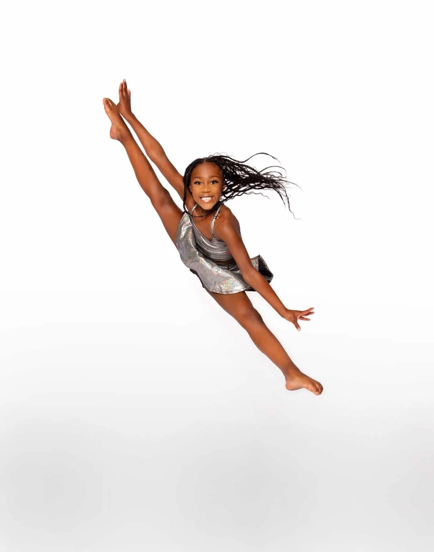 🪩

#browngirlsdoballet #brownballerina #dancephotography 

🩰: @mini_germonie 
📸: @elainepetitephotography

Image Description: Dancer jumps in a tilt position with her arms reflecting the shape of her legs. She is wearing a silver dress and is agai