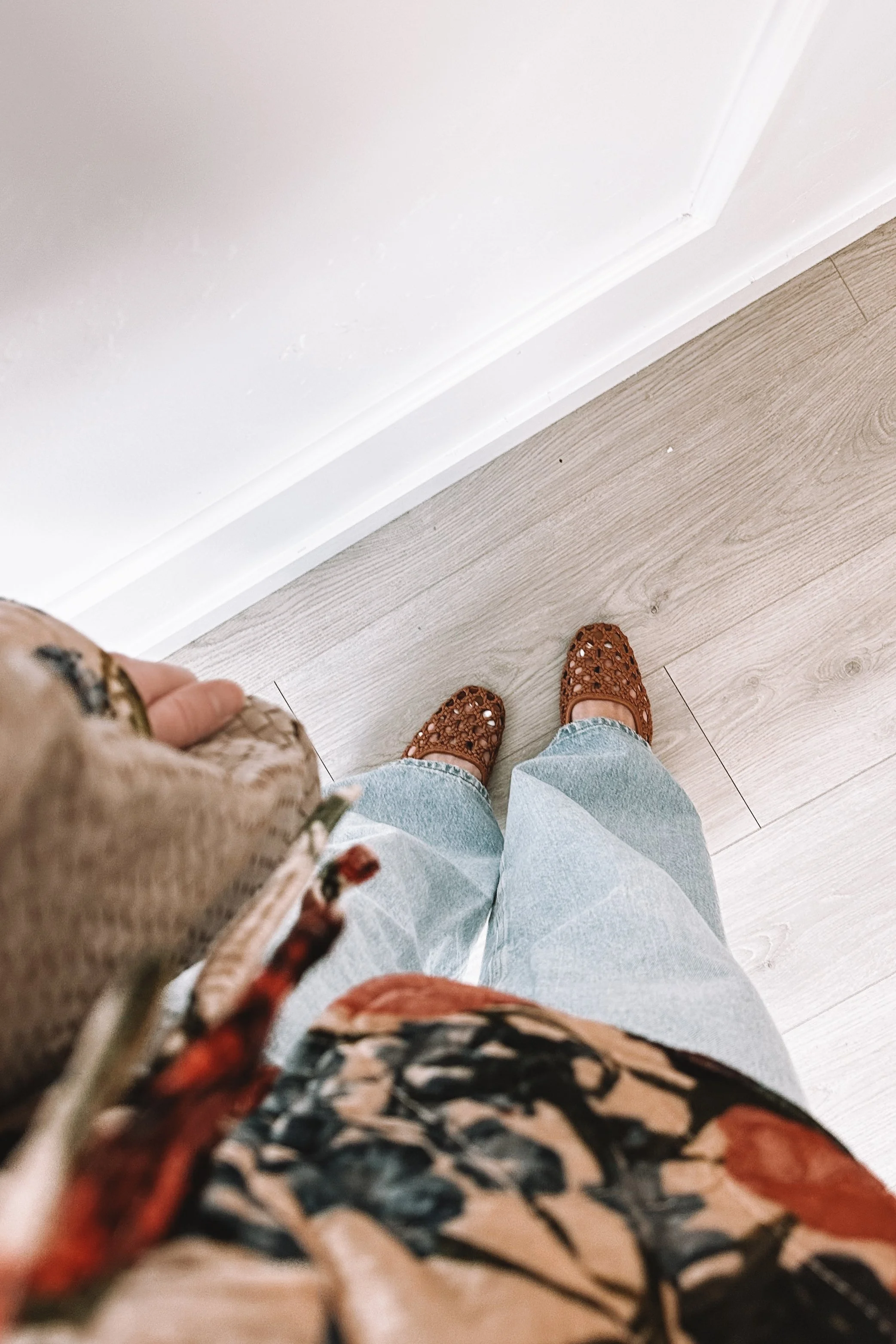Easy everyday mom outfit with floral blouse and wide leg jeans