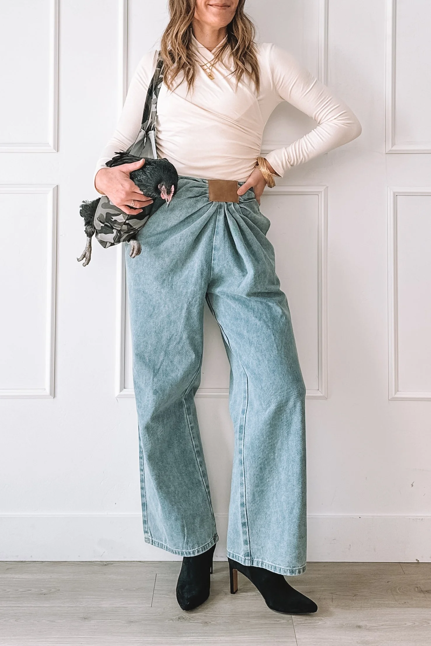 Neutral date night outfit with wide leg jeans and heels