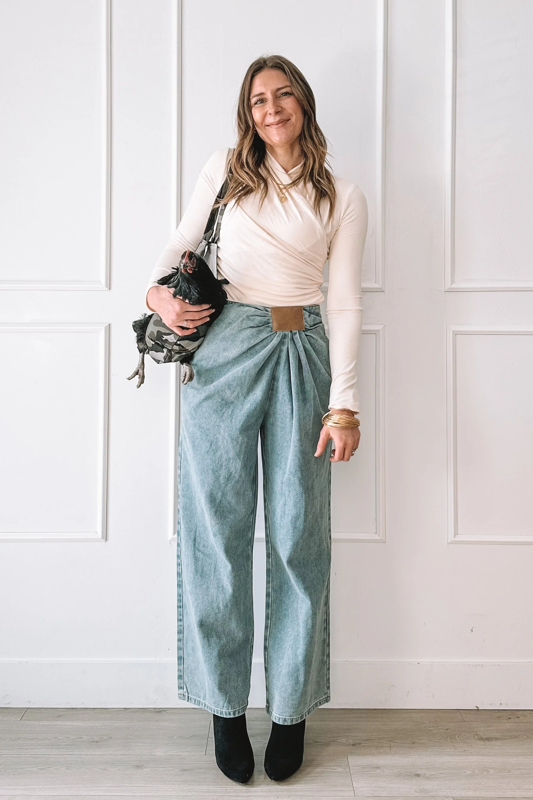 Neutral date night outfit with wide leg jeans and heels