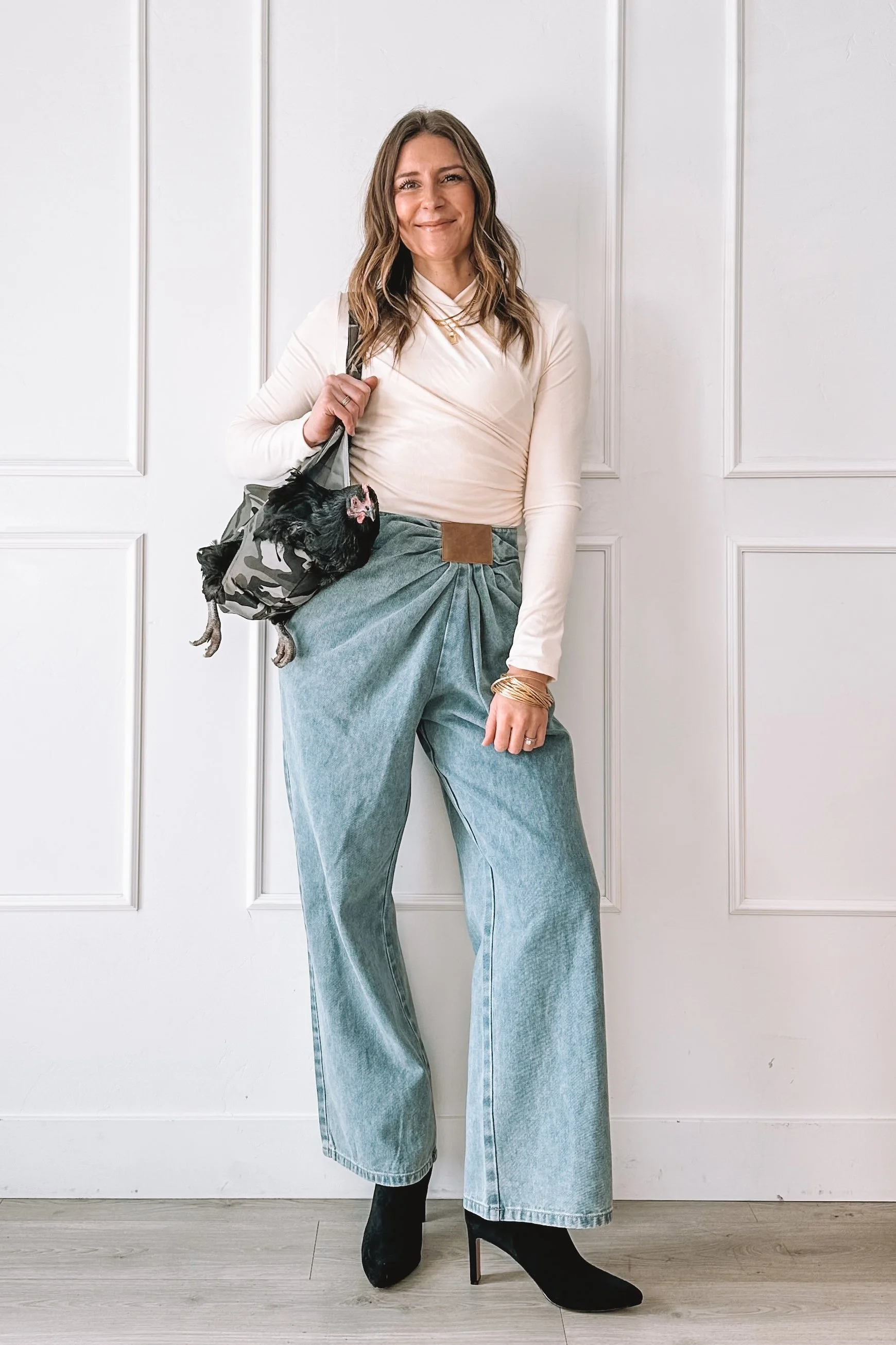 Neutral date night outfit with wide leg jeans and heels