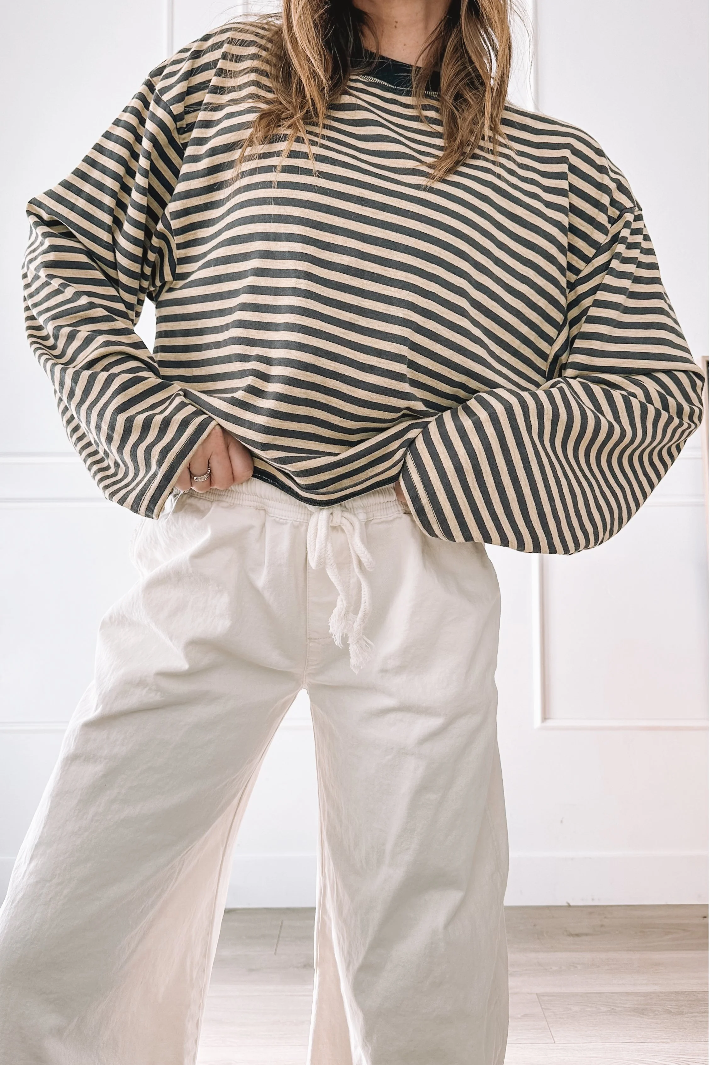 casual mom outfit with striped top and white jeans