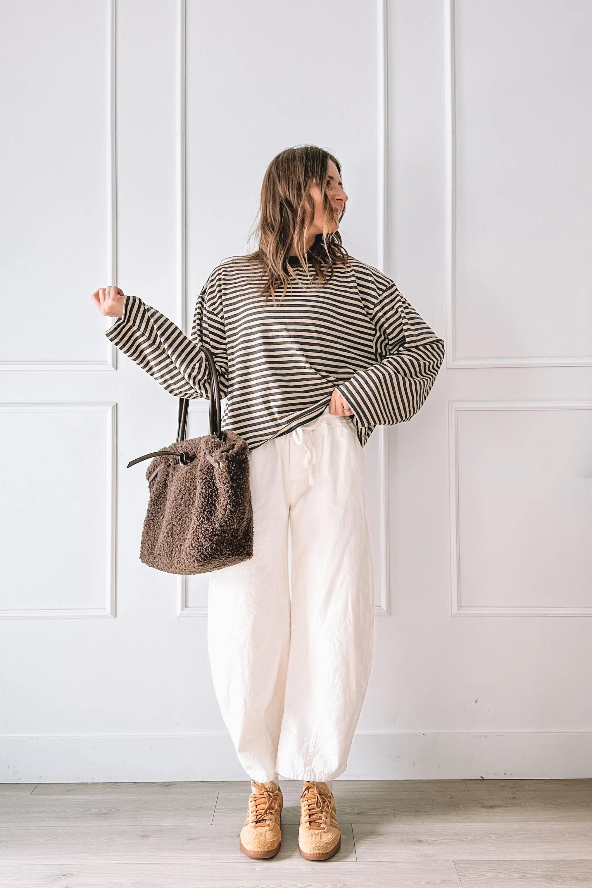 casual mom outfit with striped top and white jeans