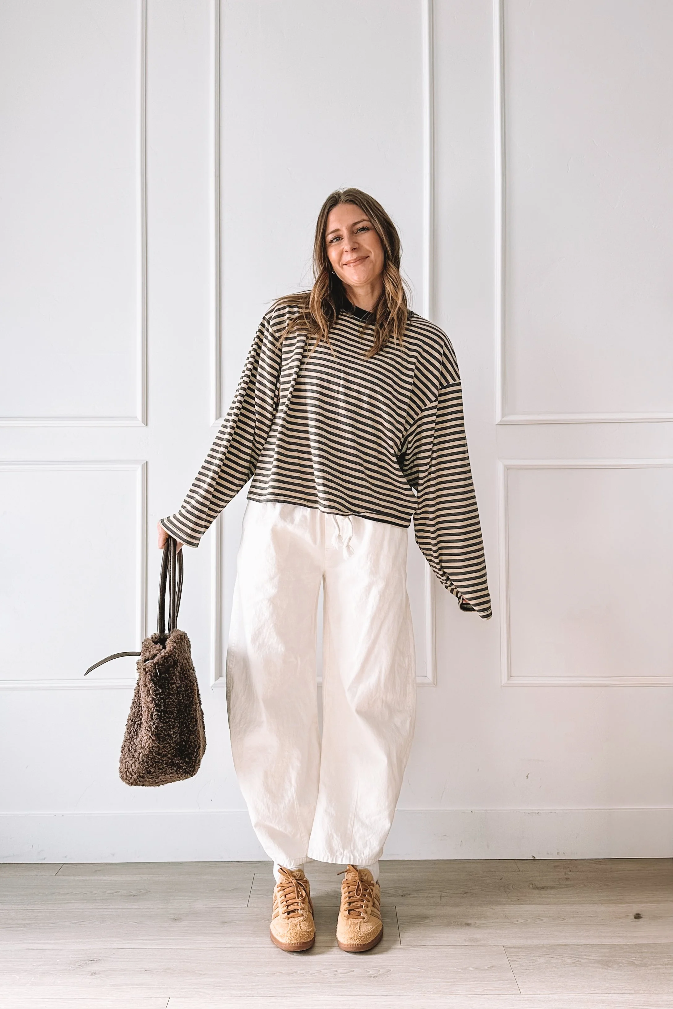 casual mom outfit with striped top and white jeans