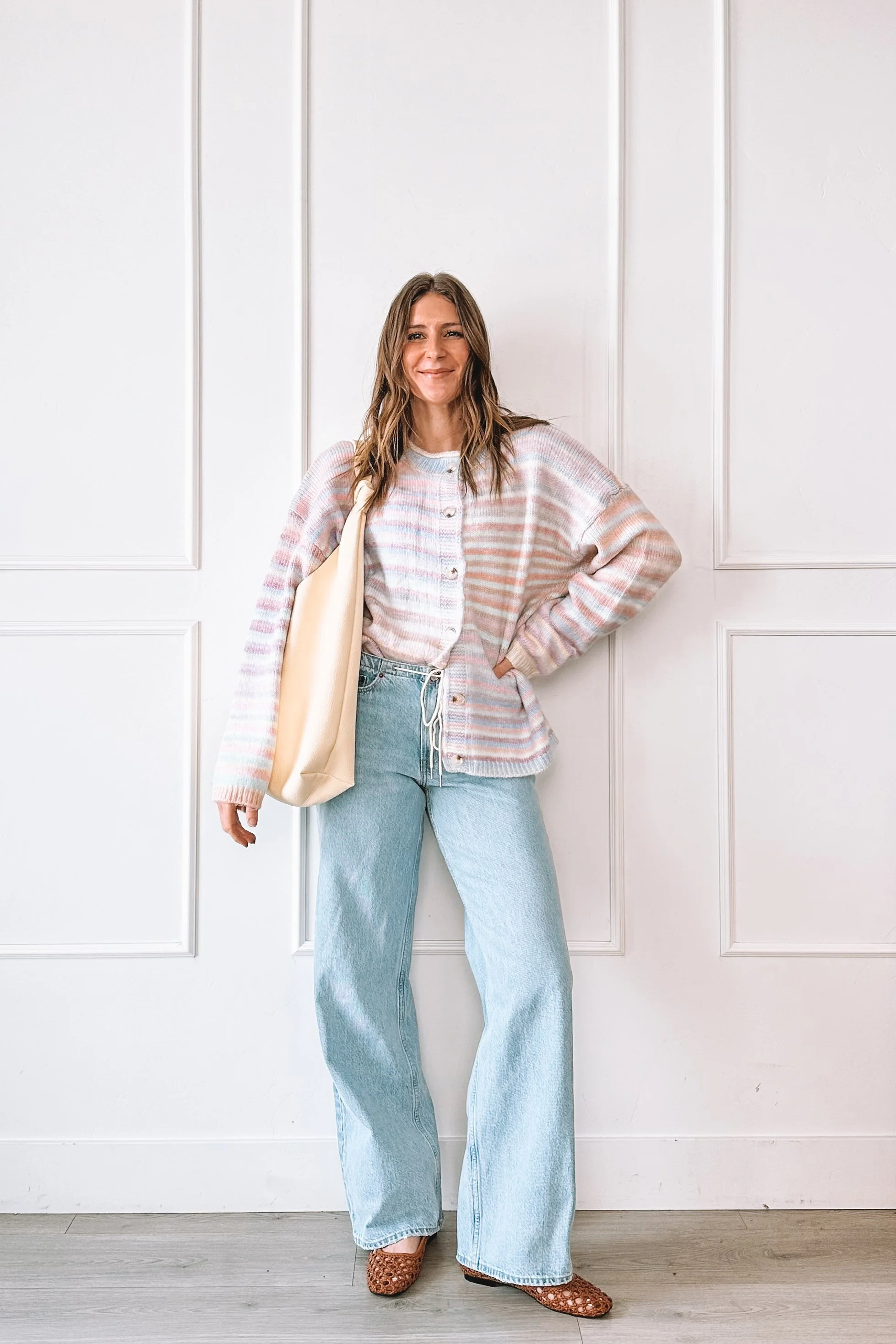 winter to spring everyday outfit with knit top and relaxed jeans