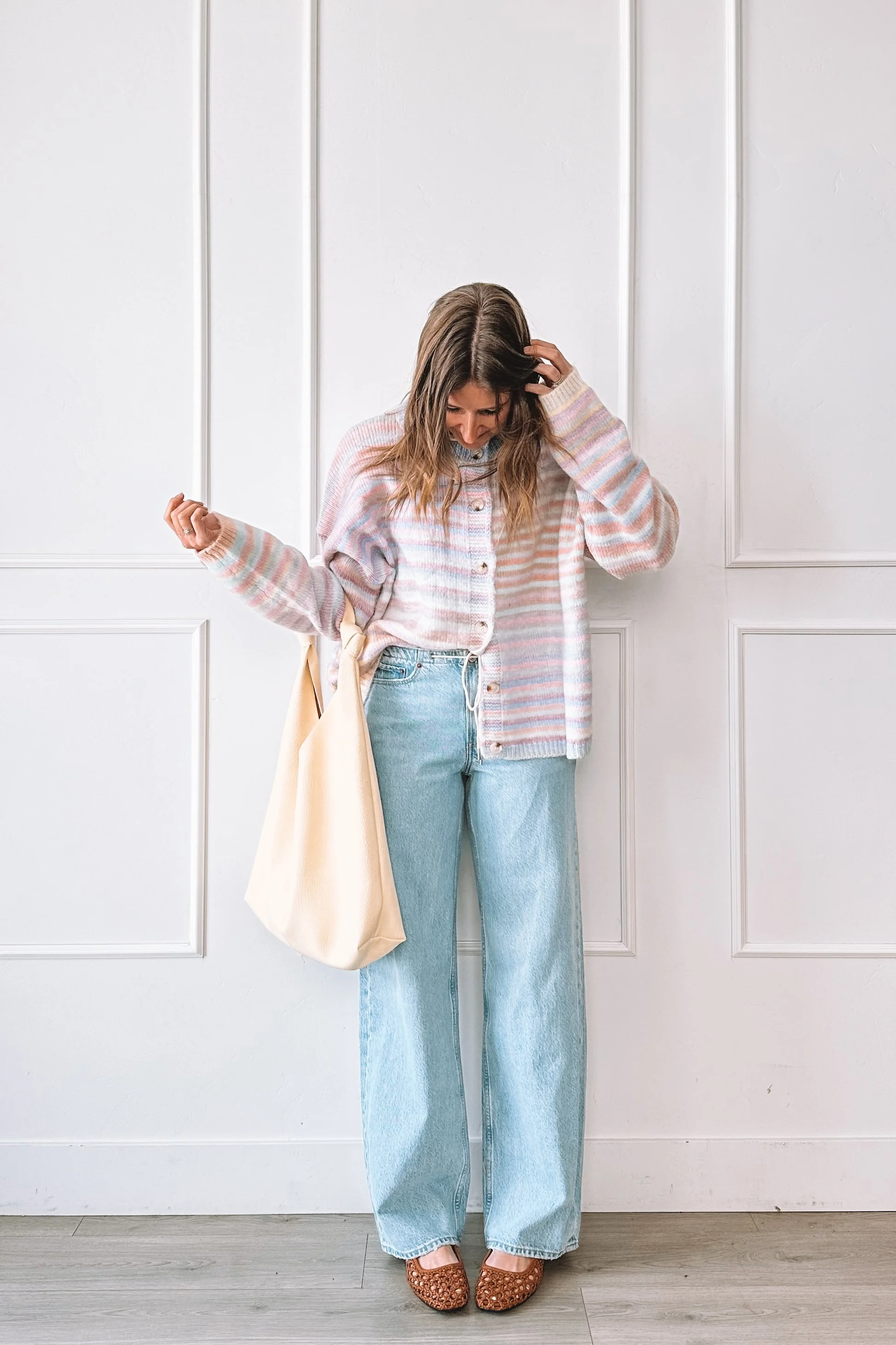 winter to spring everyday outfit with knit top and relaxed jeans