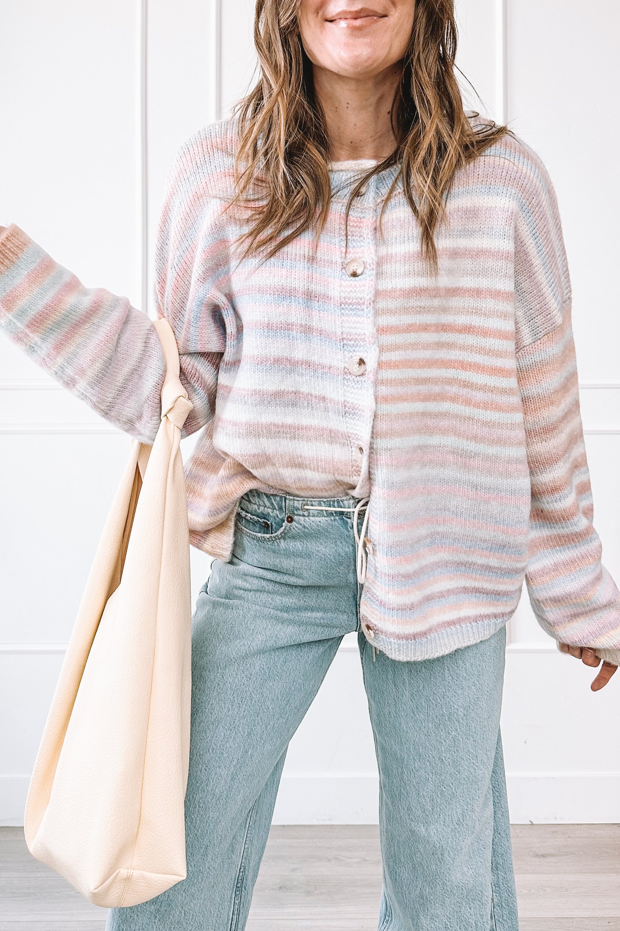 winter to spring everyday outfit with knit top and relaxed jeans