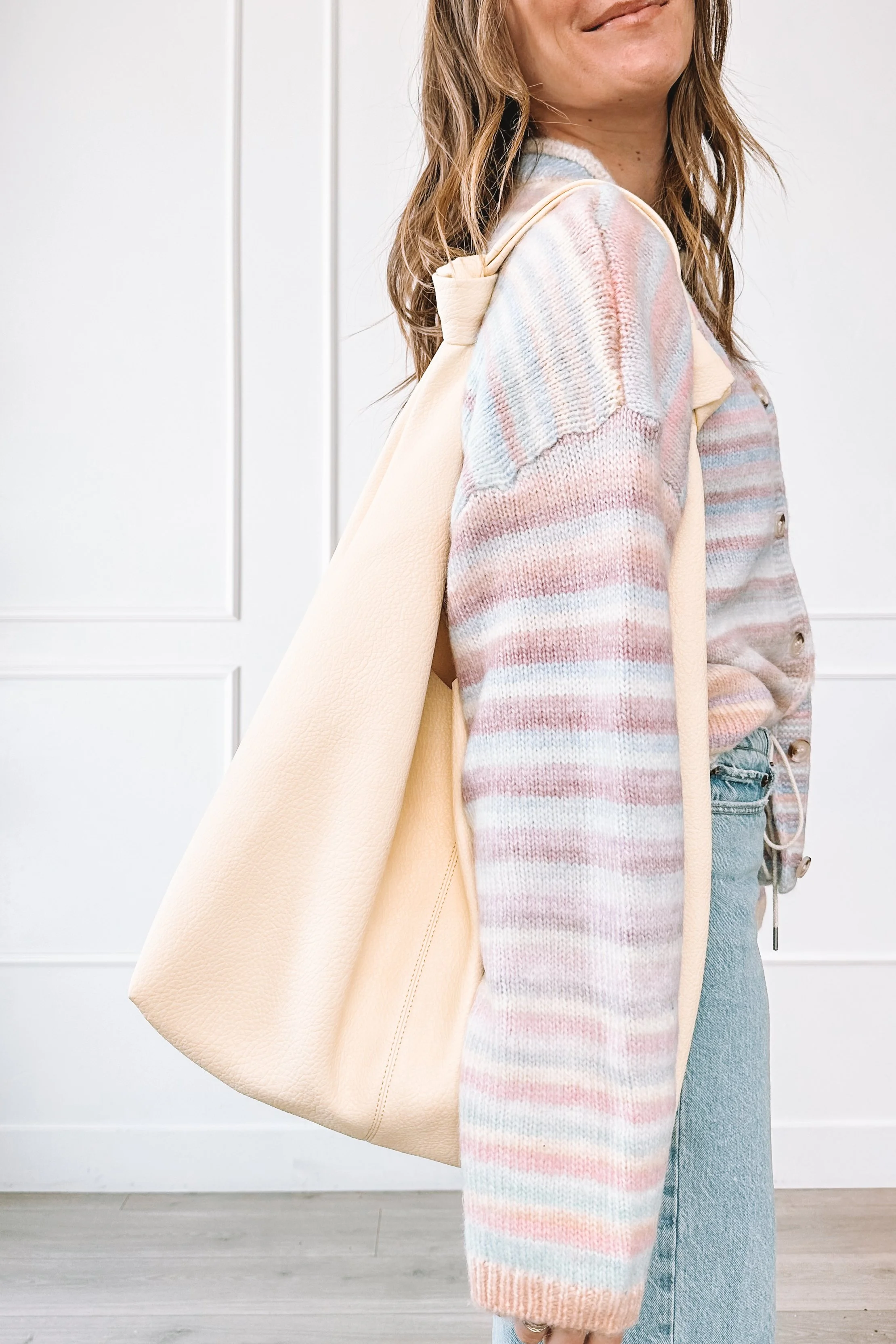 winter to spring everyday outfit with knit top and relaxed jeans