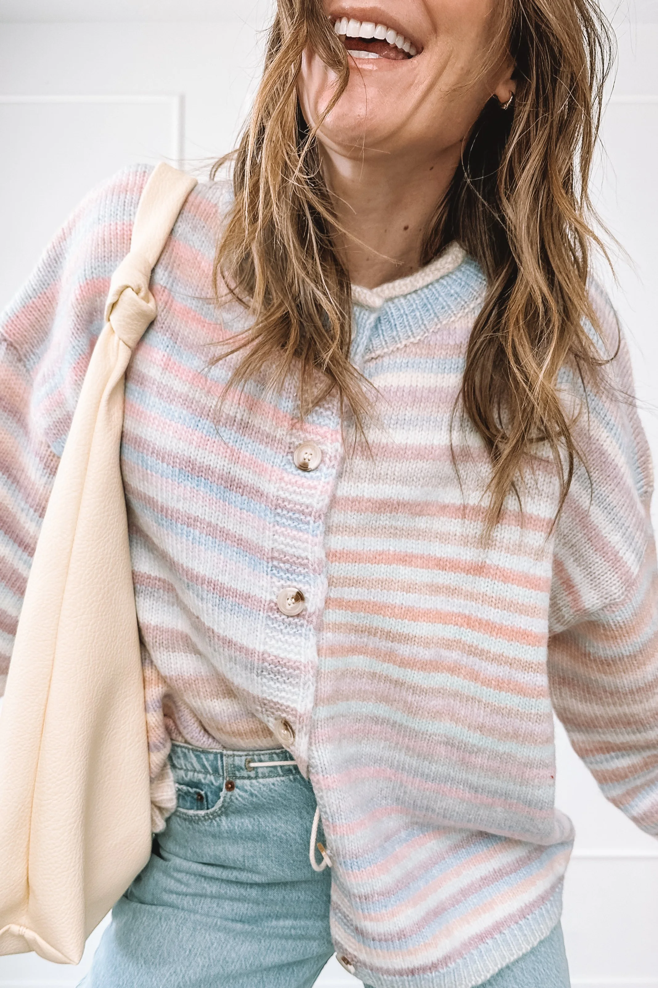 winter to spring everyday outfit with knit top and relaxed jeans