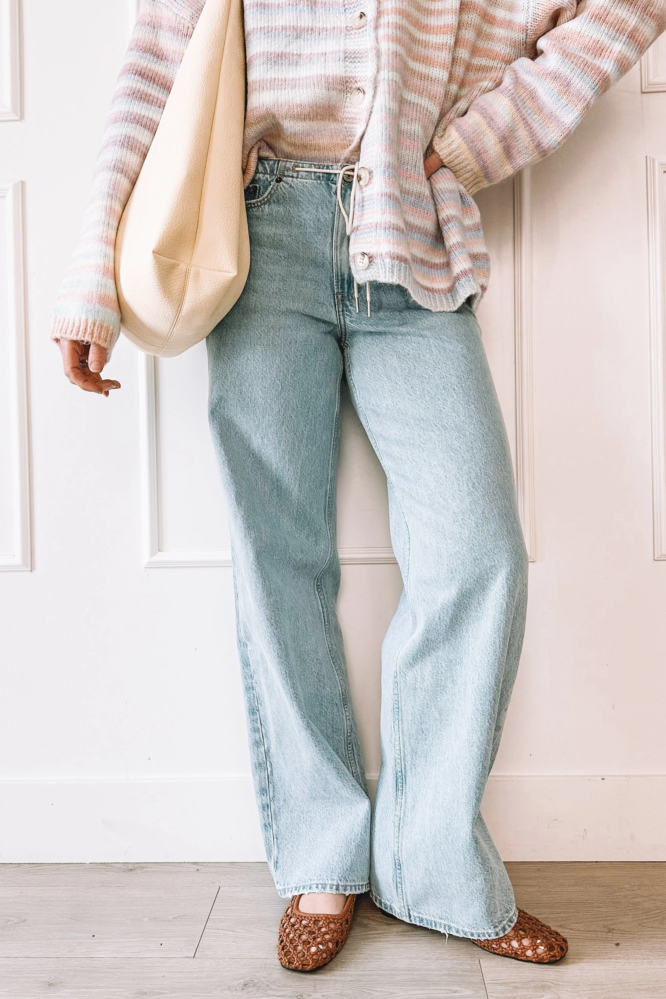 winter to spring everyday outfit with knit top and relaxed jeans