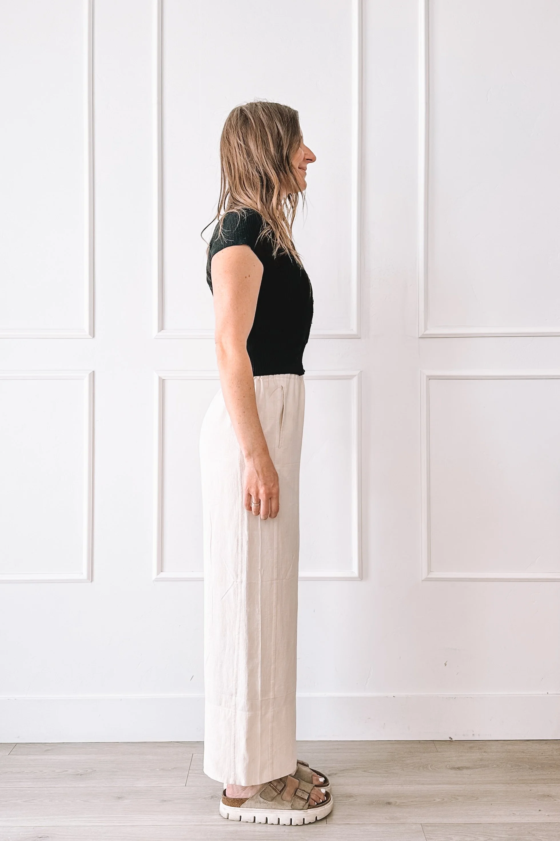 Black Top Cream Pants Casual Outfit