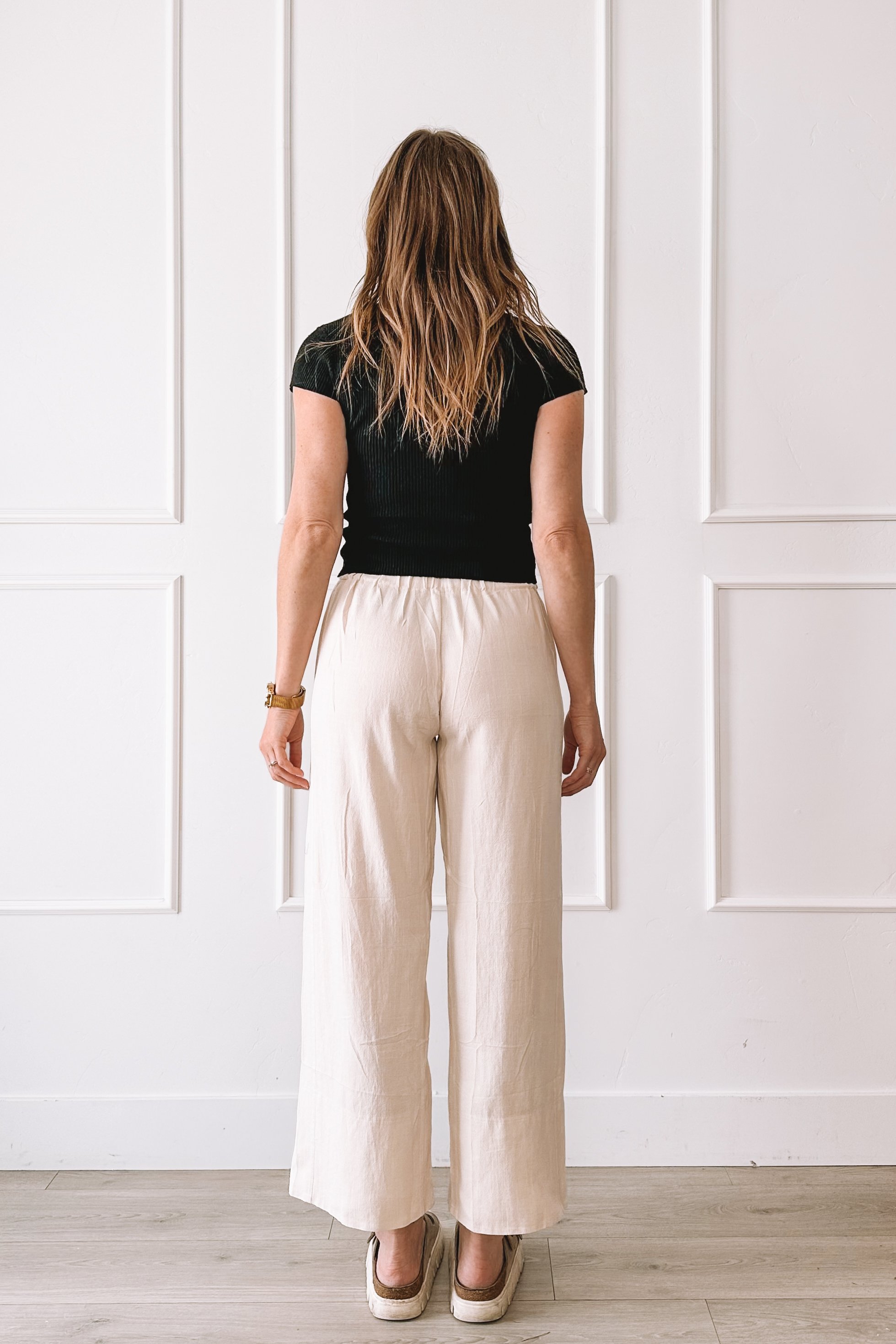 Black Top Cream Pants Casual Outfit