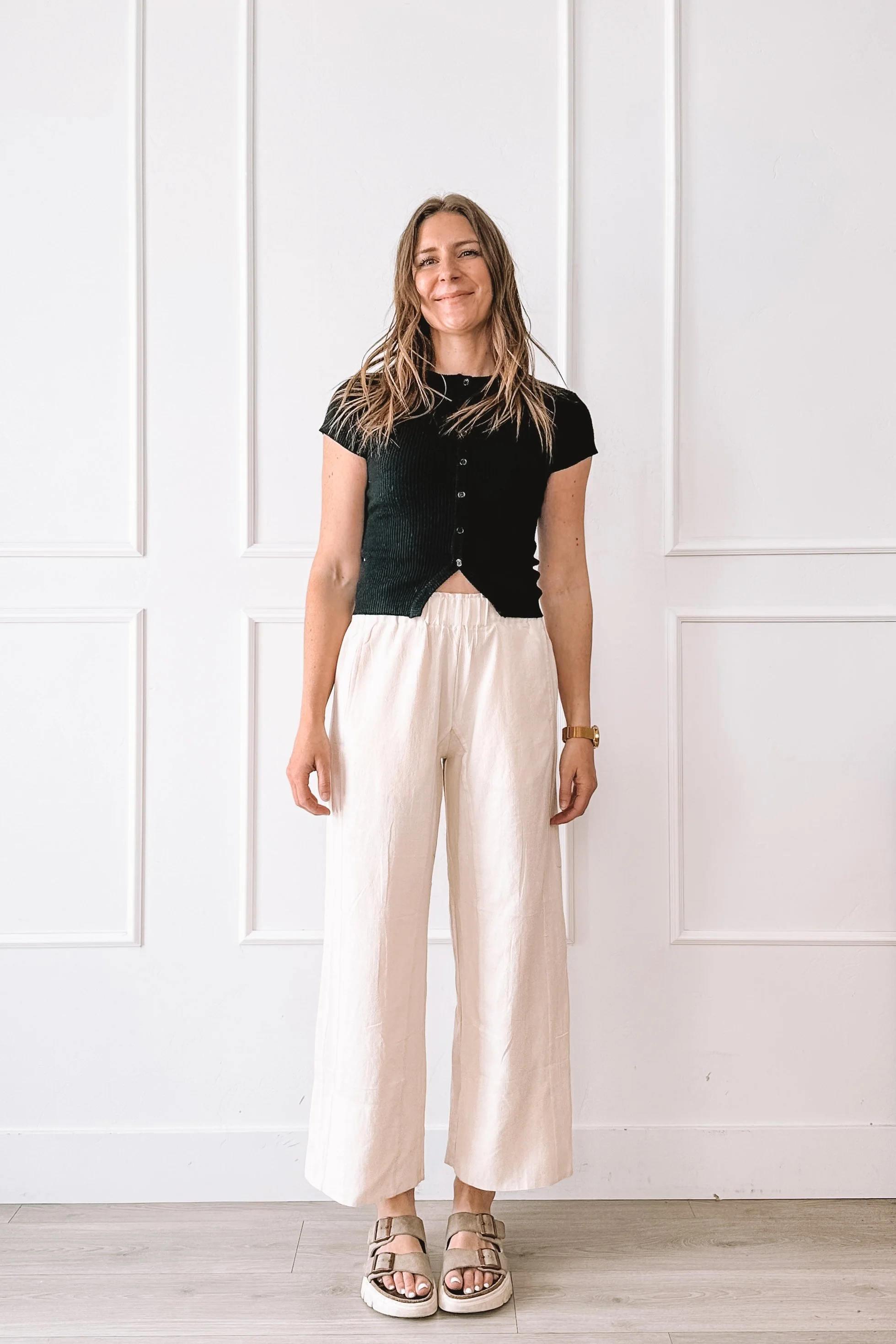 Black Top Cream Pants Casual Outfit