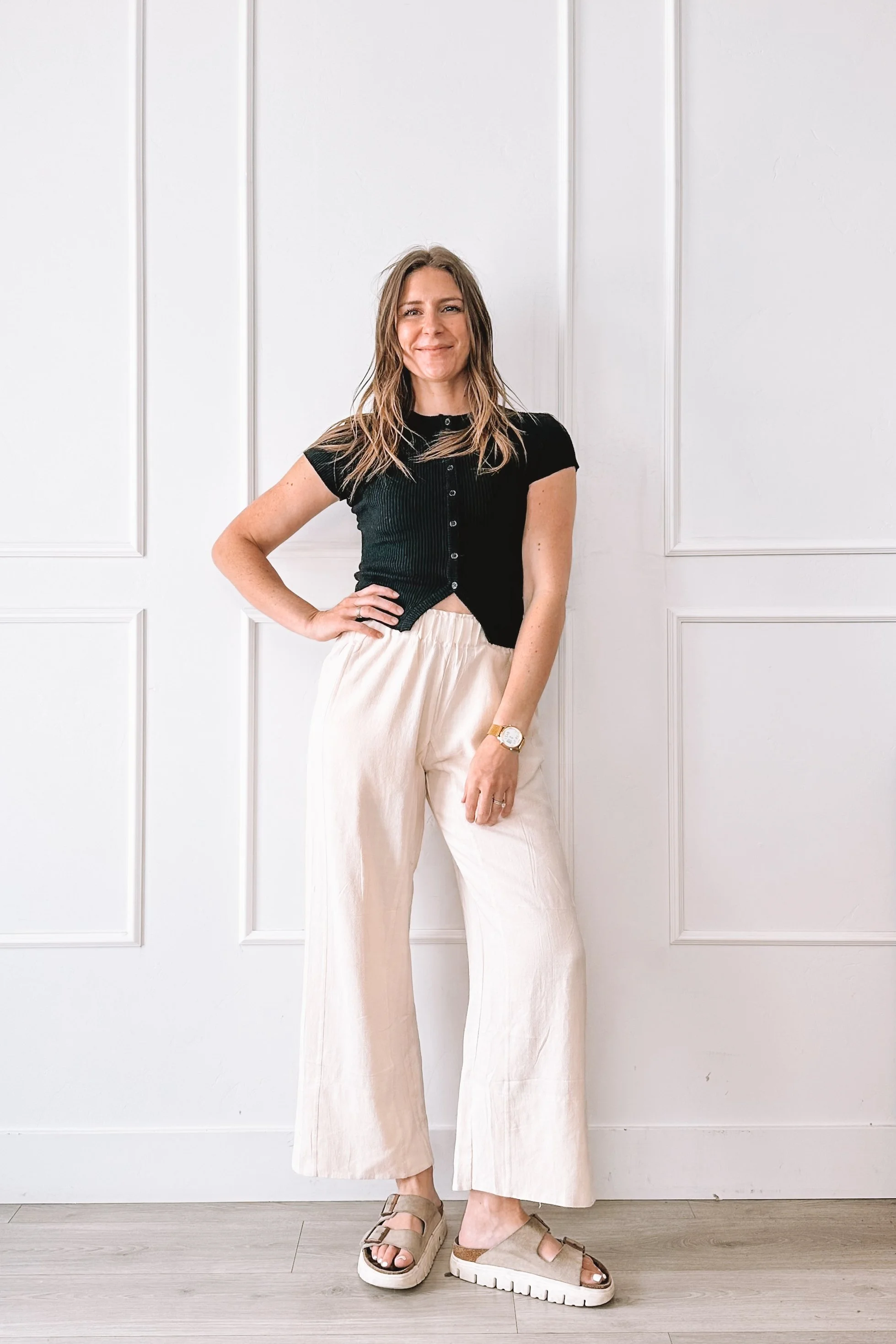 Black Top Cream Pants Casual Outfit