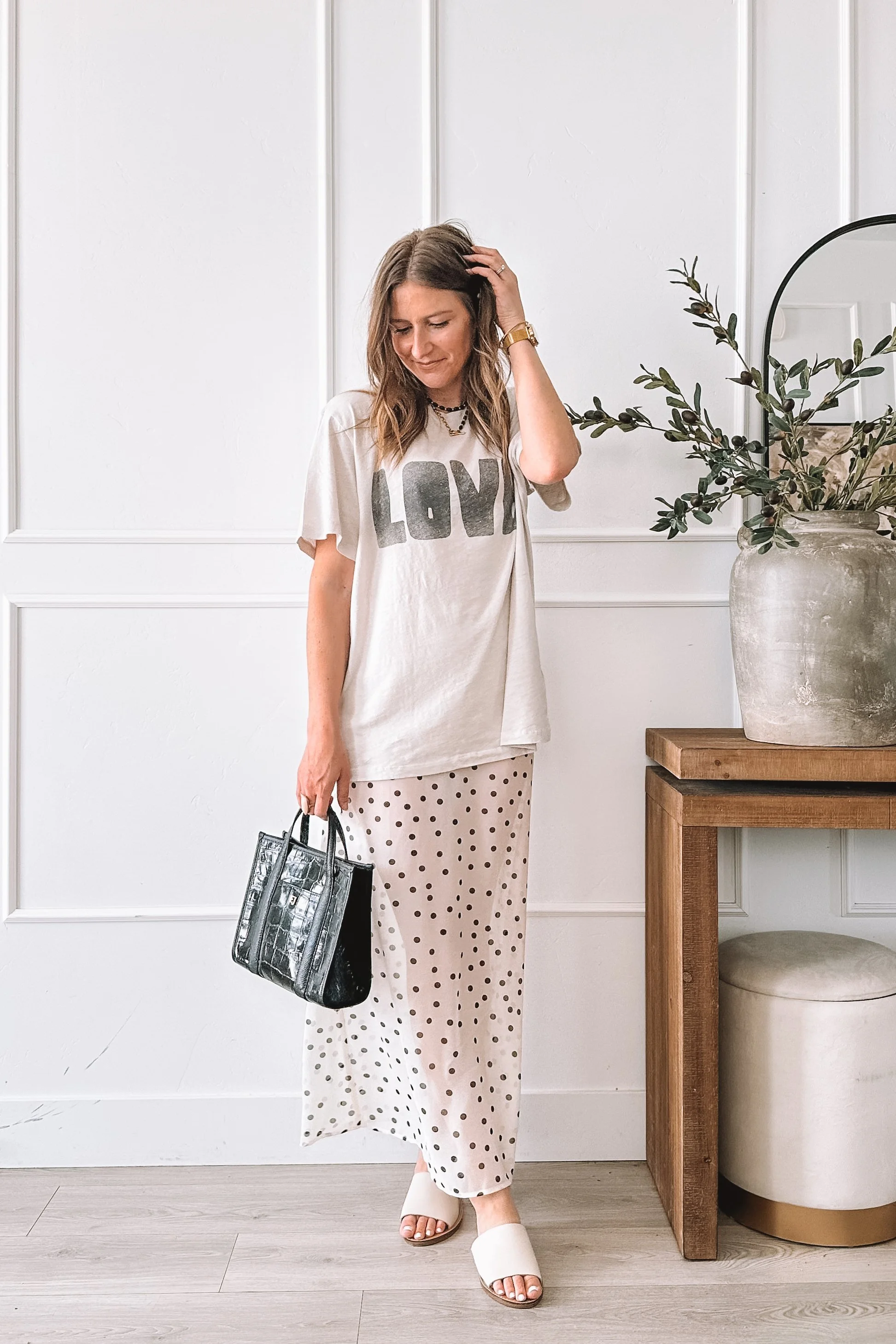 Polka Dot Midi Skirt Spring Outfit with Graphic Tee and Steve Madden Slides
