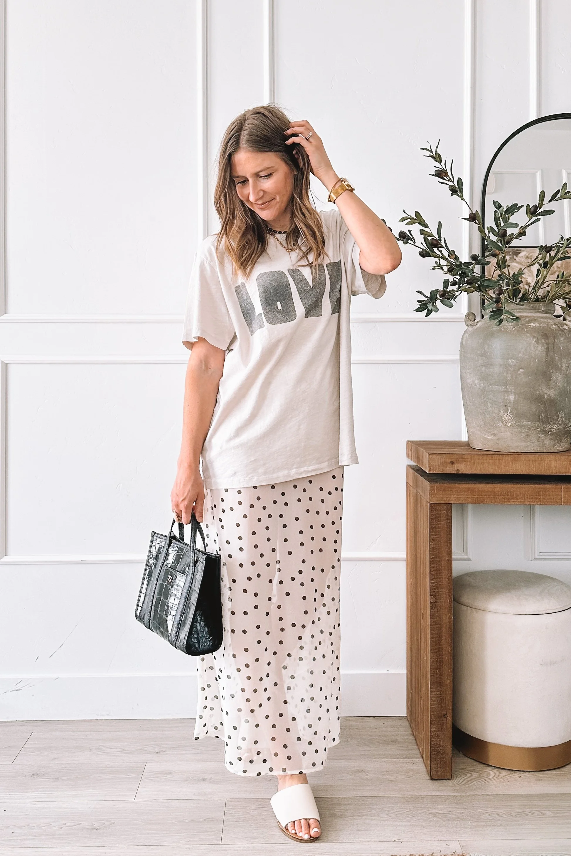 Polka Dot Midi Skirt Spring Outfit with Graphic Tee and Steve Madden Slides