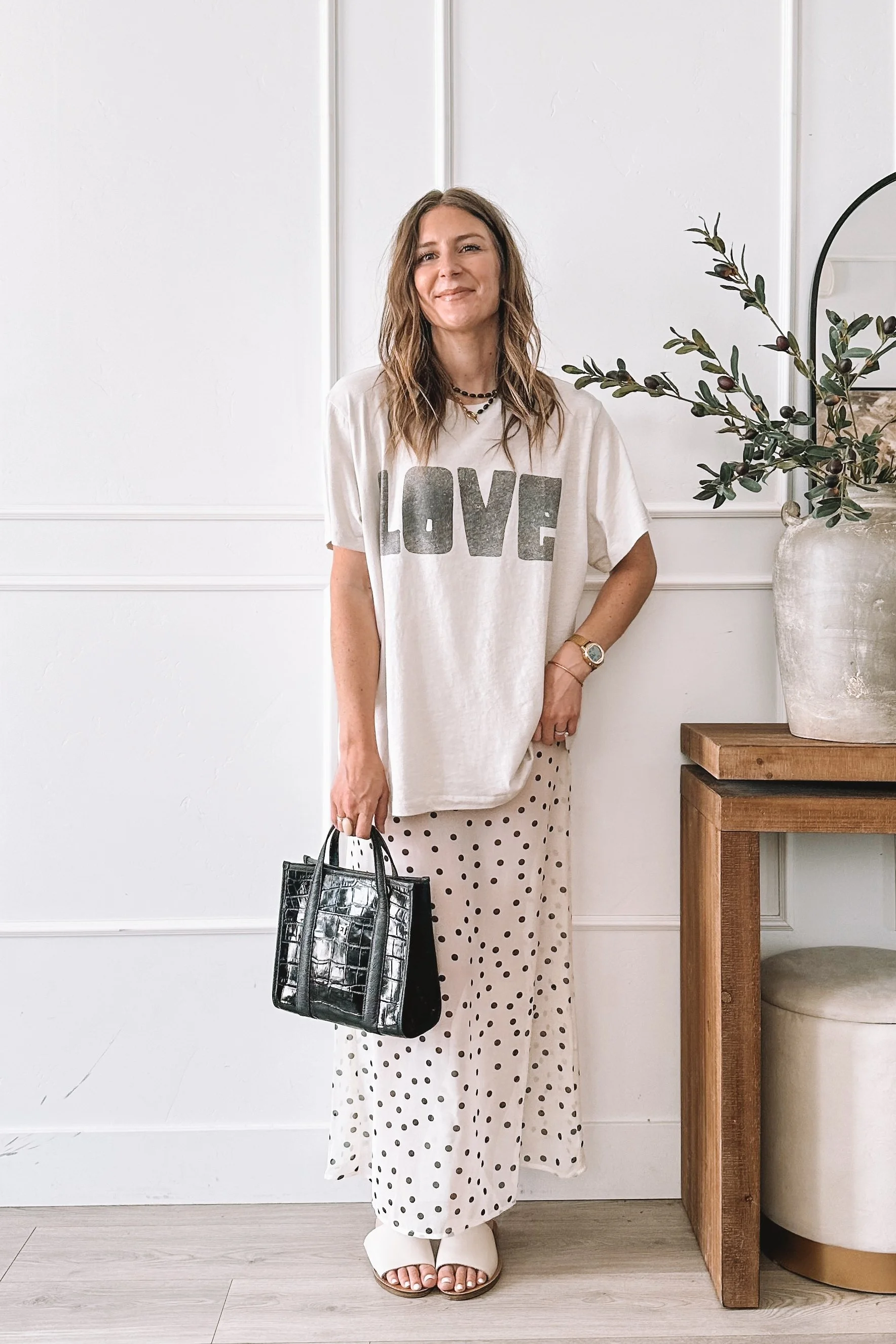 Polka Dot Midi Skirt Spring Outfit with Graphic Tee and Steve Madden Slides