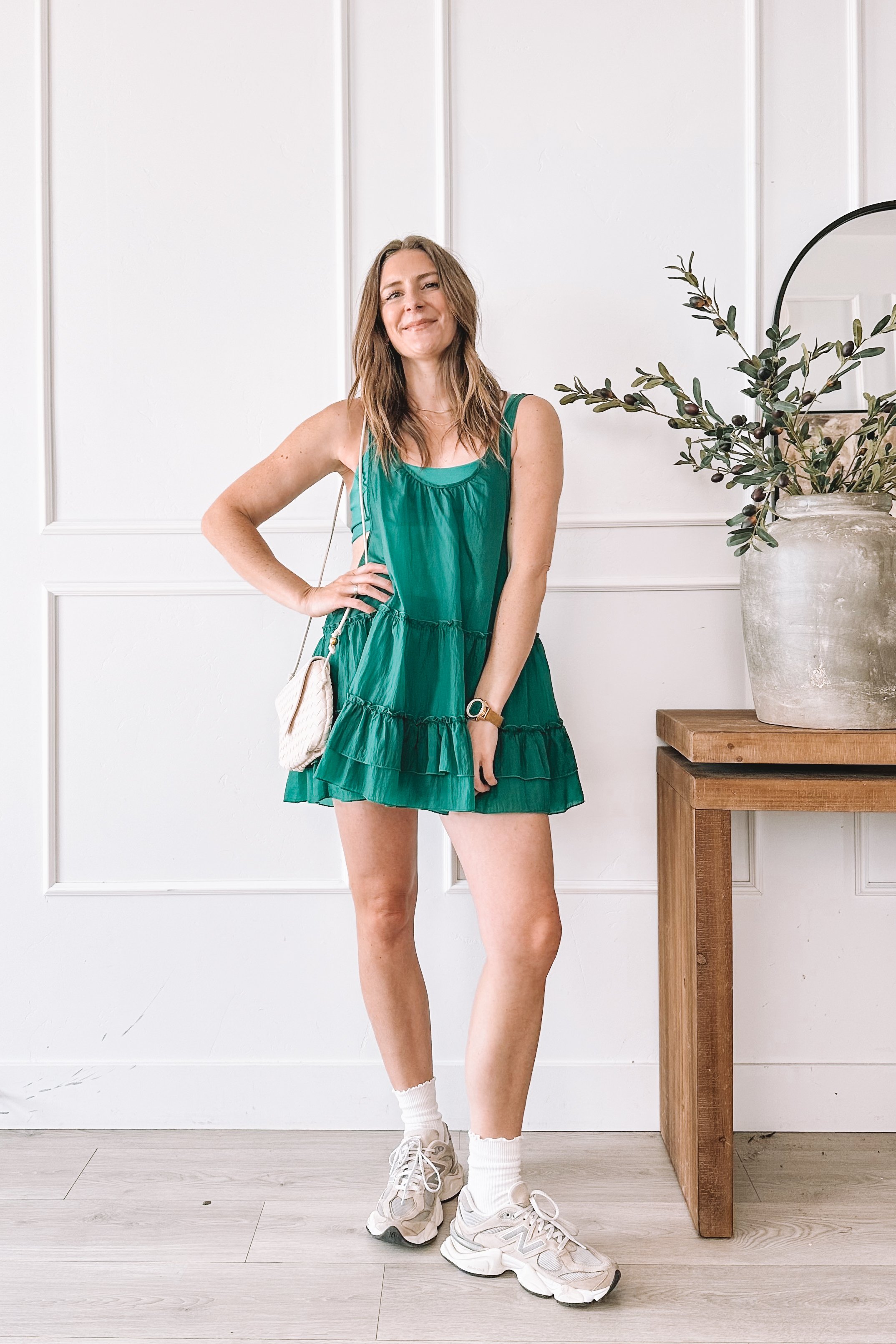 green tiered mini dress with sneakers everyday outfit idea