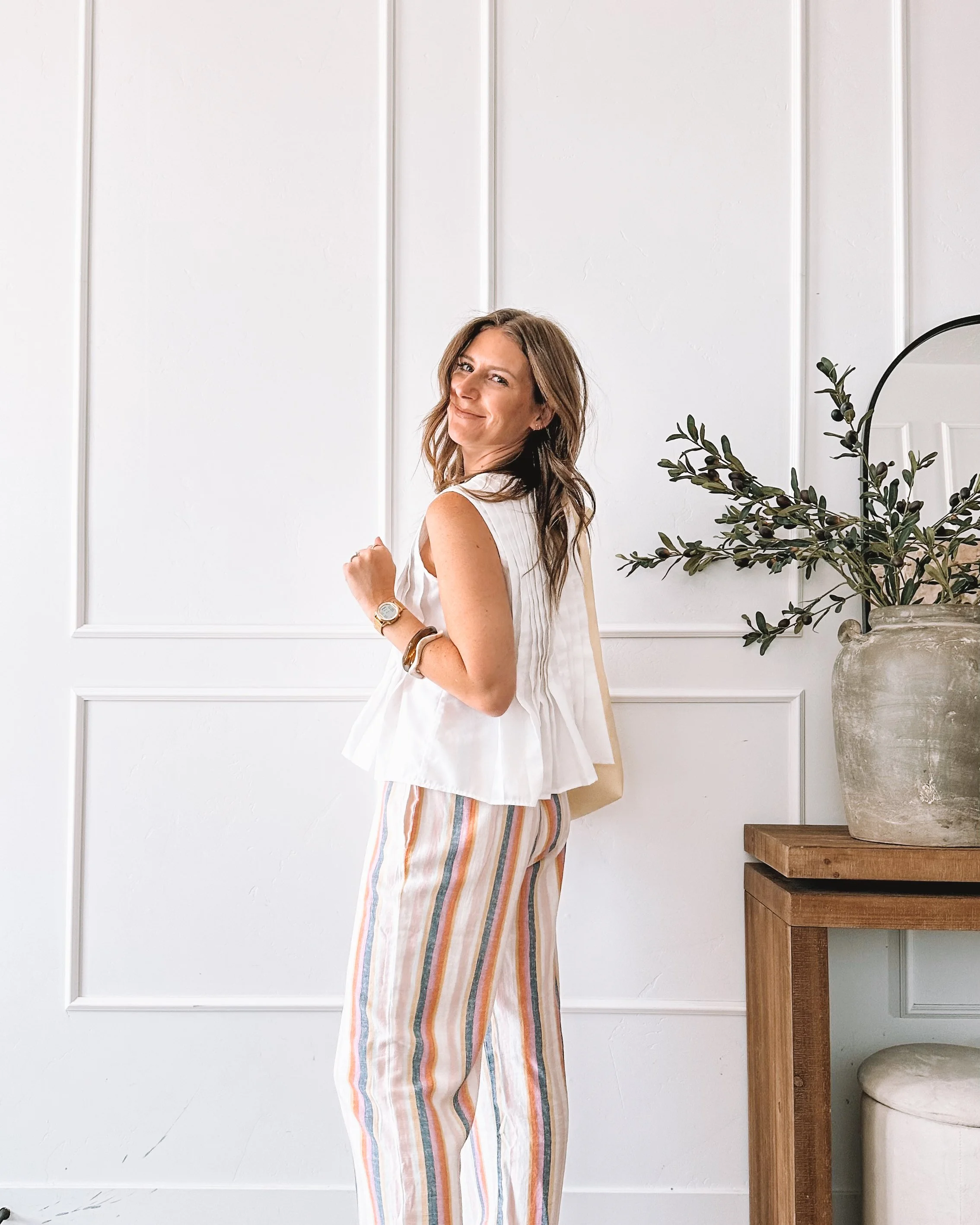 white peplum top with rainbow striped pants