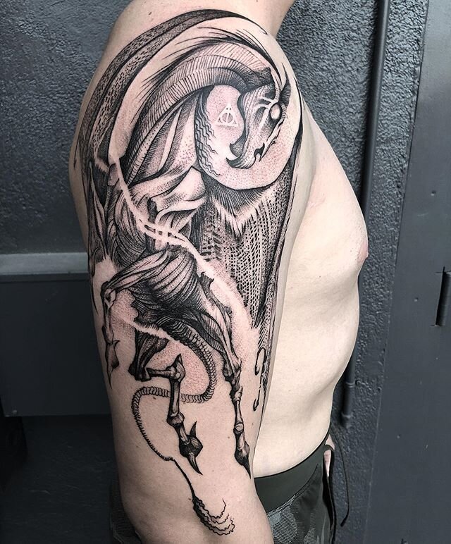 They're called Thestrals. They're quite gentle really but people avoid them because, they're a bit...different.
Thanks Zack. 🐴💀🧙&zwj;♂️ Swipe to see the wrap-around. 
#bodyelectrictattoo #thestral #thestraltattoo #harrypottertattoo #harrypottertat