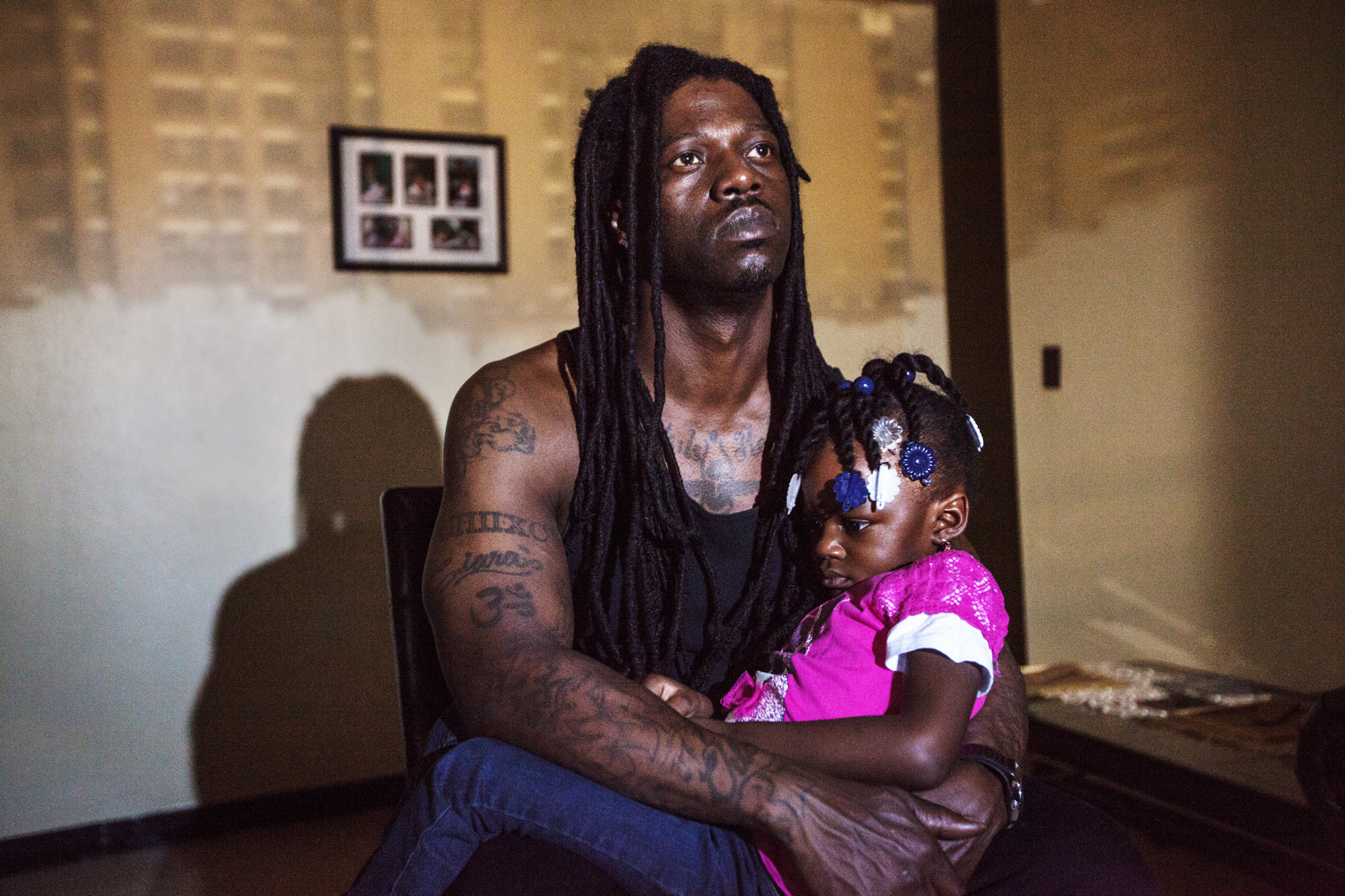 Raheem Grant, 39, poses for a portrait with his daughter, Nature Grant. “When I was growing up I didn’ t have a father. My little one, she gets scared of the dark: ‘ You don’ t have to be scared because Daddy is here.’ Just knowing that I am there for them makes me feel like I accomplished a lot.